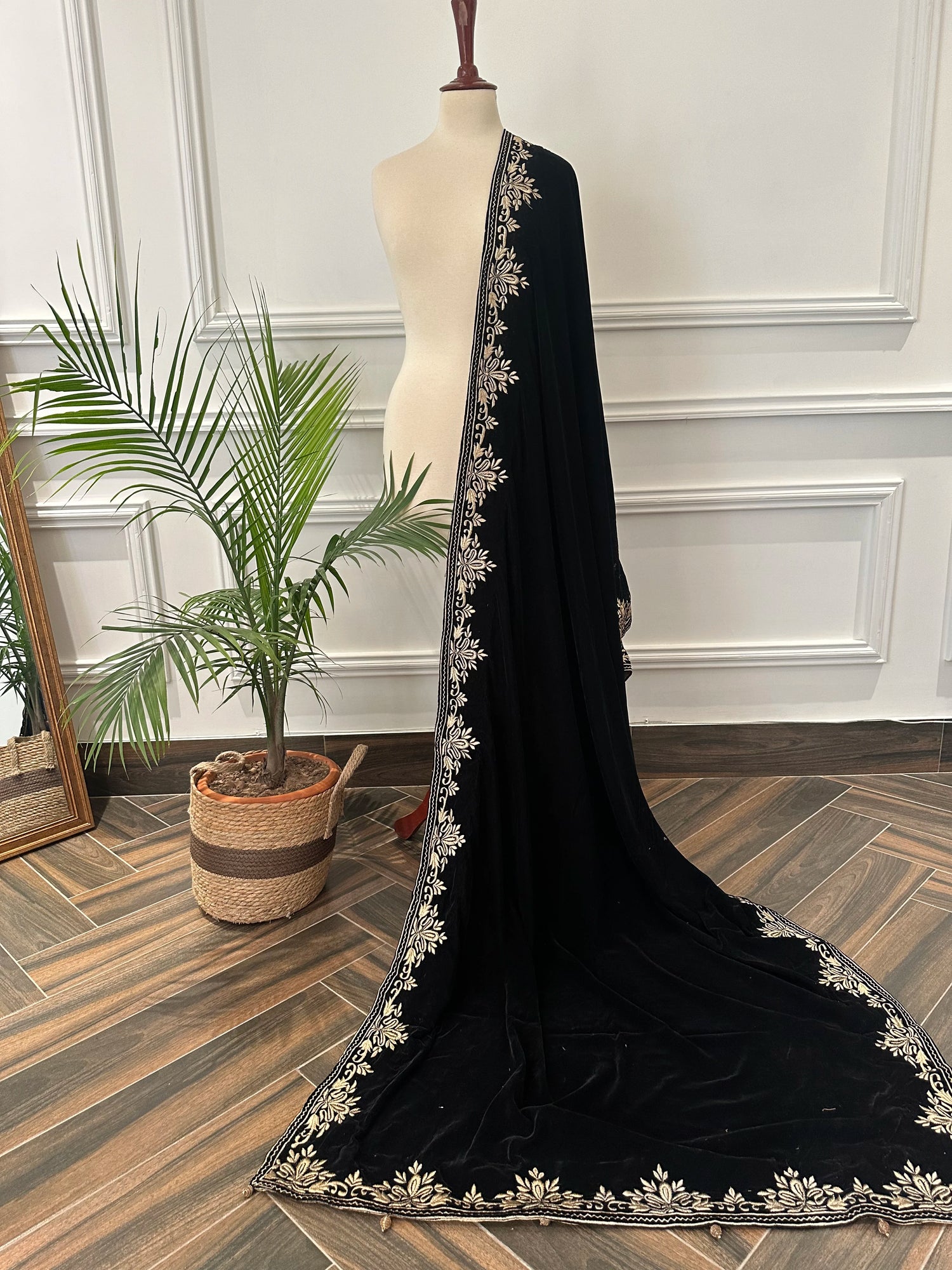 Elevate your style with Royal Luxe unisex velvet shawl with fine golden thread embroidery on four sides, featuring Jamawar palta lining on the back of borders, ideal for weddings and festive occasions.