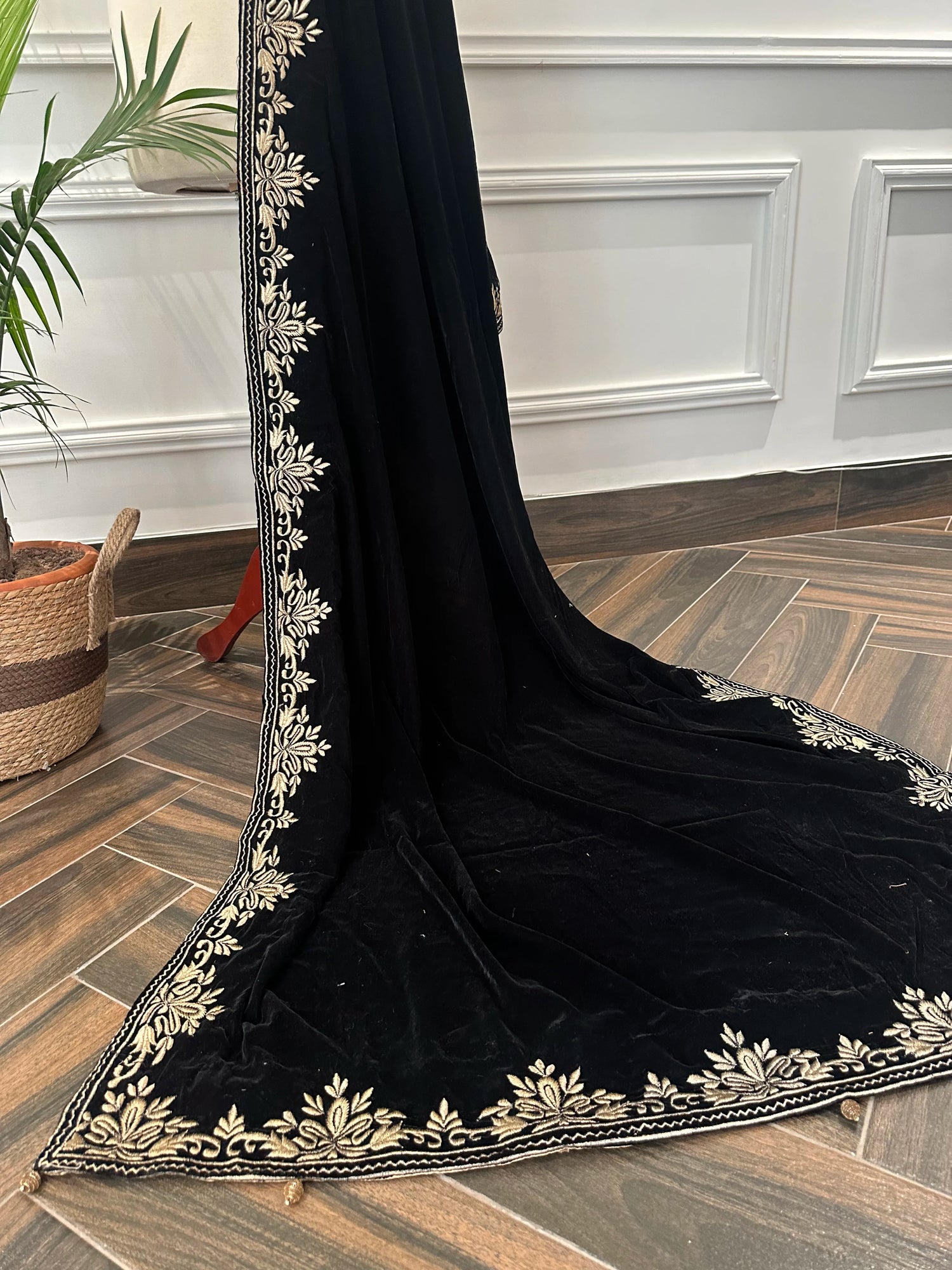 Elevate your style with Royal Luxe unisex velvet shawl with fine golden thread embroidery on four sides, featuring Jamawar palta lining on the back of borders, ideal for weddings and festive occasions.
