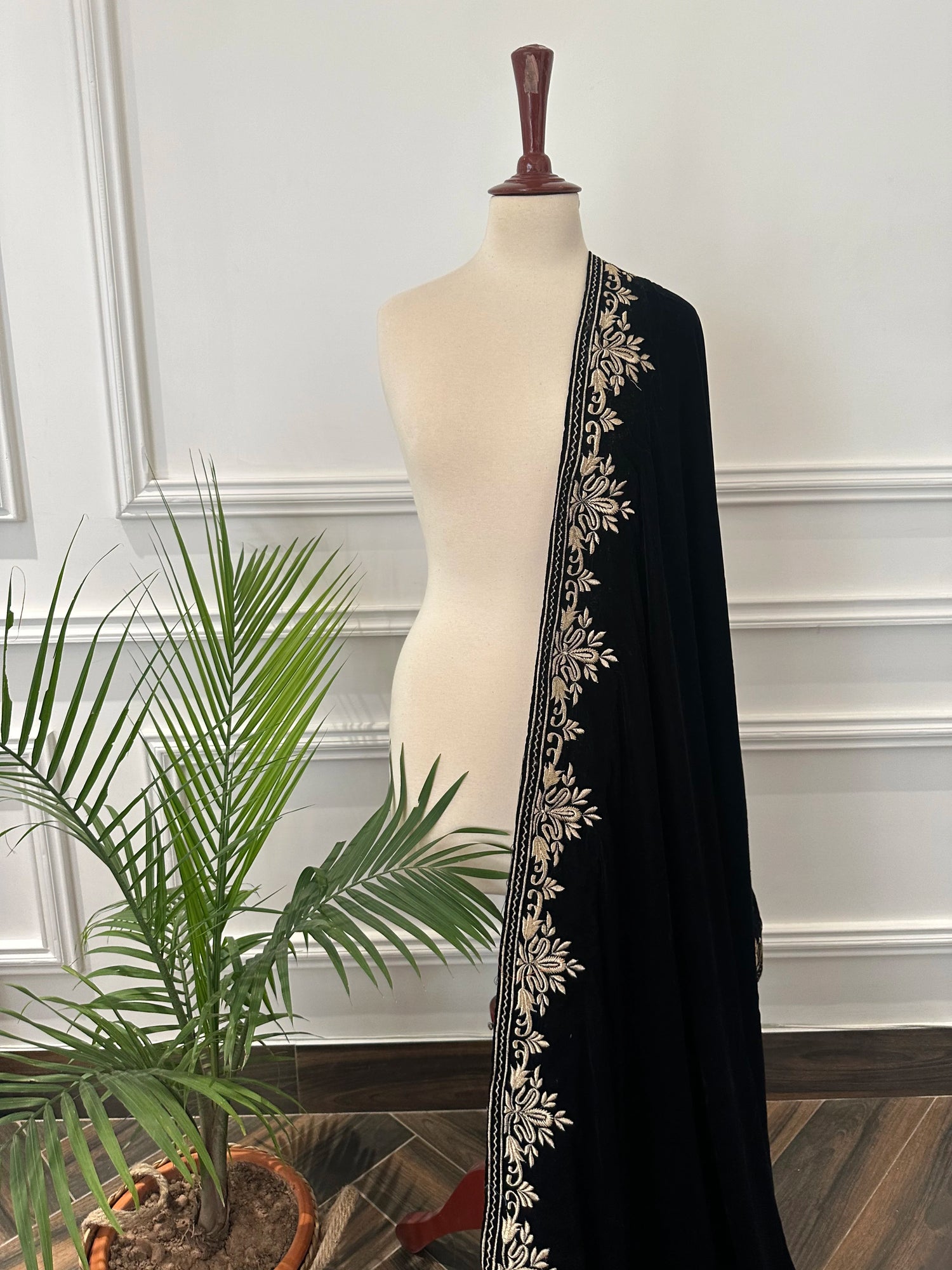 Elevate your style with Royal Luxe unisex velvet shawl with fine golden thread embroidery on four sides, featuring Jamawar palta lining on the back of borders, ideal for weddings and festive occasions.