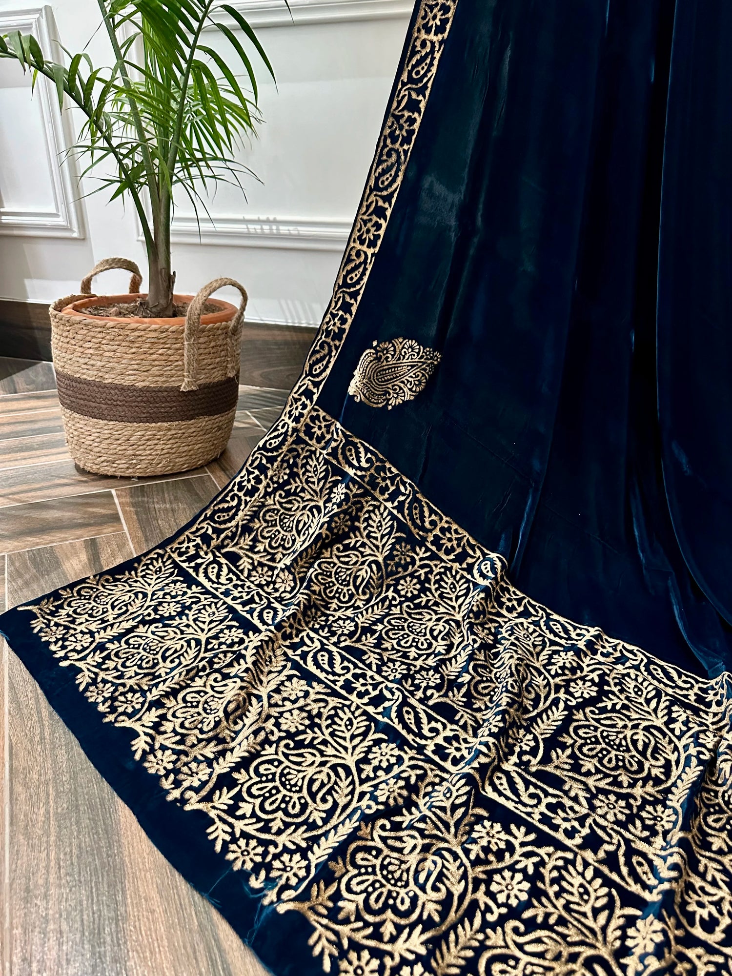 A luxurious block printed shawl, designed with double floral border, creating a perfect blend of traditional craftsmanship and modern elegance.
