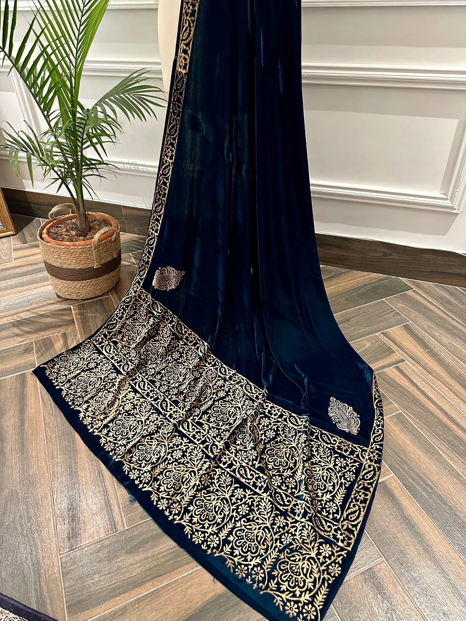 A luxurious block printed shawl, designed with double floral border, creating a perfect blend of traditional craftsmanship and modern elegance.