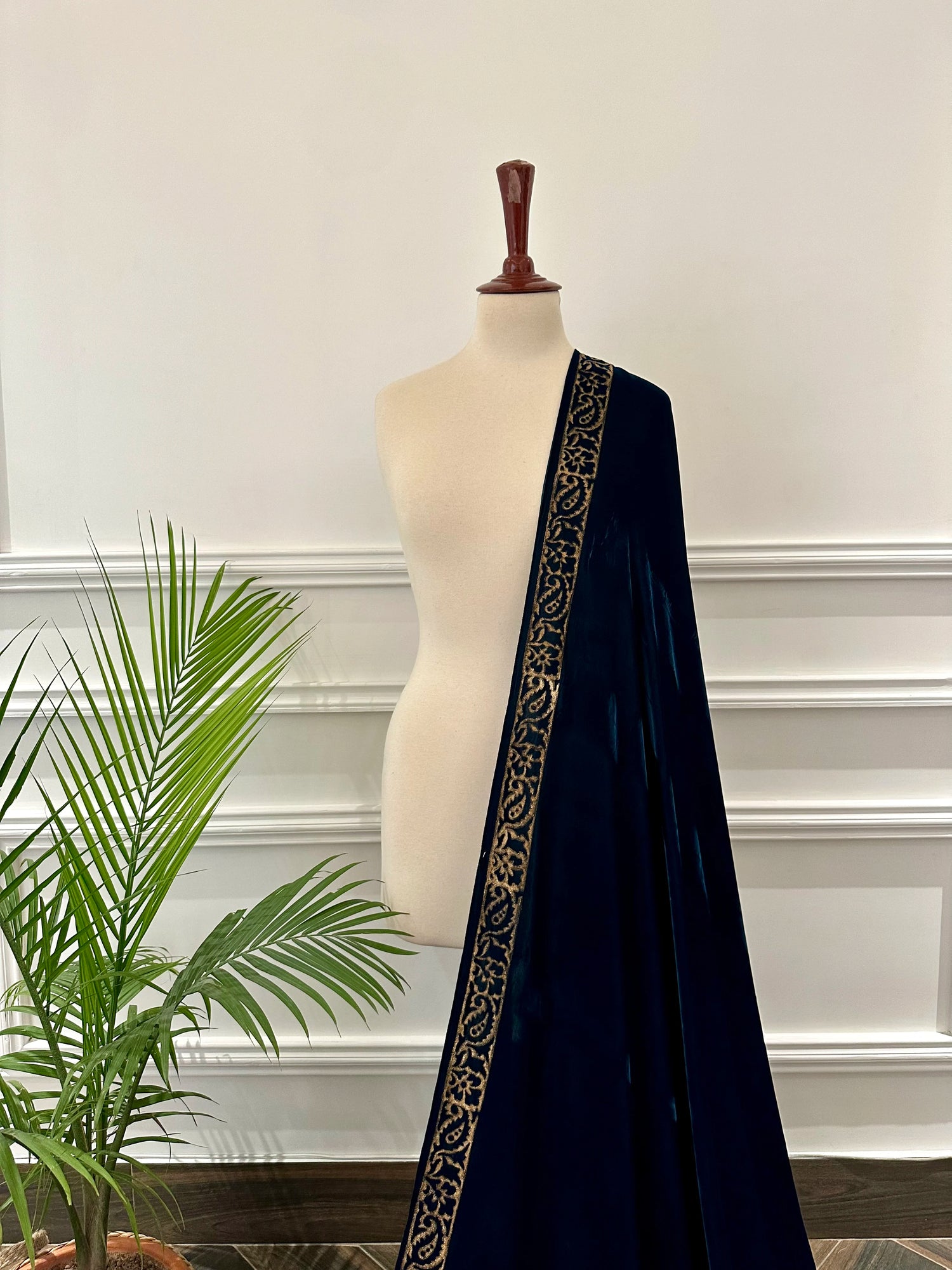 A luxurious block printed shawl, designed with double floral border, creating a perfect blend of traditional craftsmanship and modern elegance.