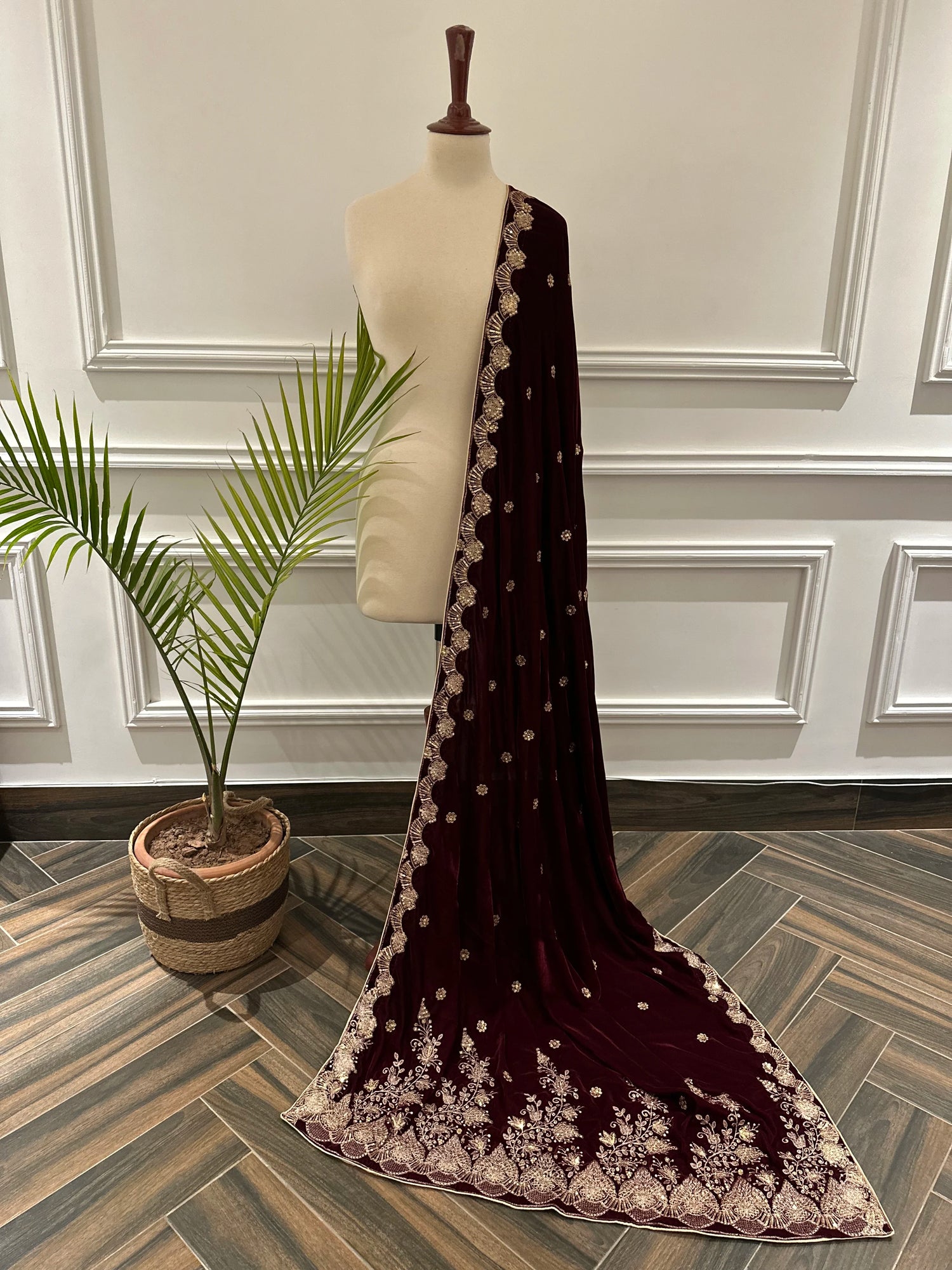 Luxurious velvet shawl featuring detailed embroidery and beautiful crafted motifs, blending traditional artistry with modern elegance for any occasion.
