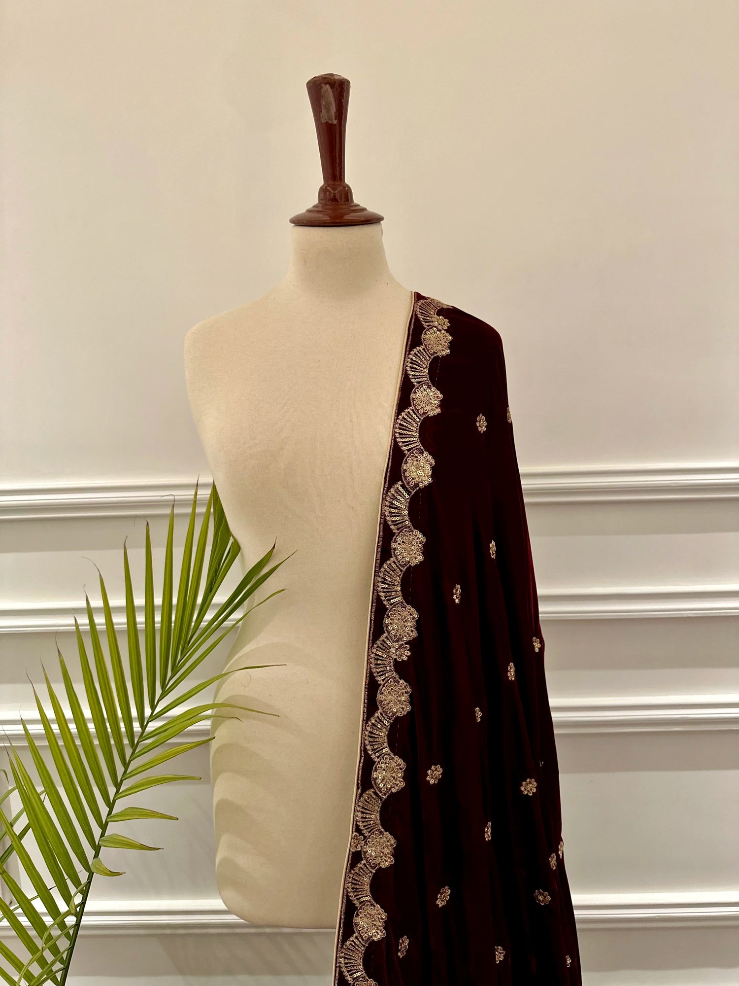 Luxurious velvet shawl featuring detailed embroidery and beautiful crafted motifs, blending traditional artistry with modern elegance for any occasion.