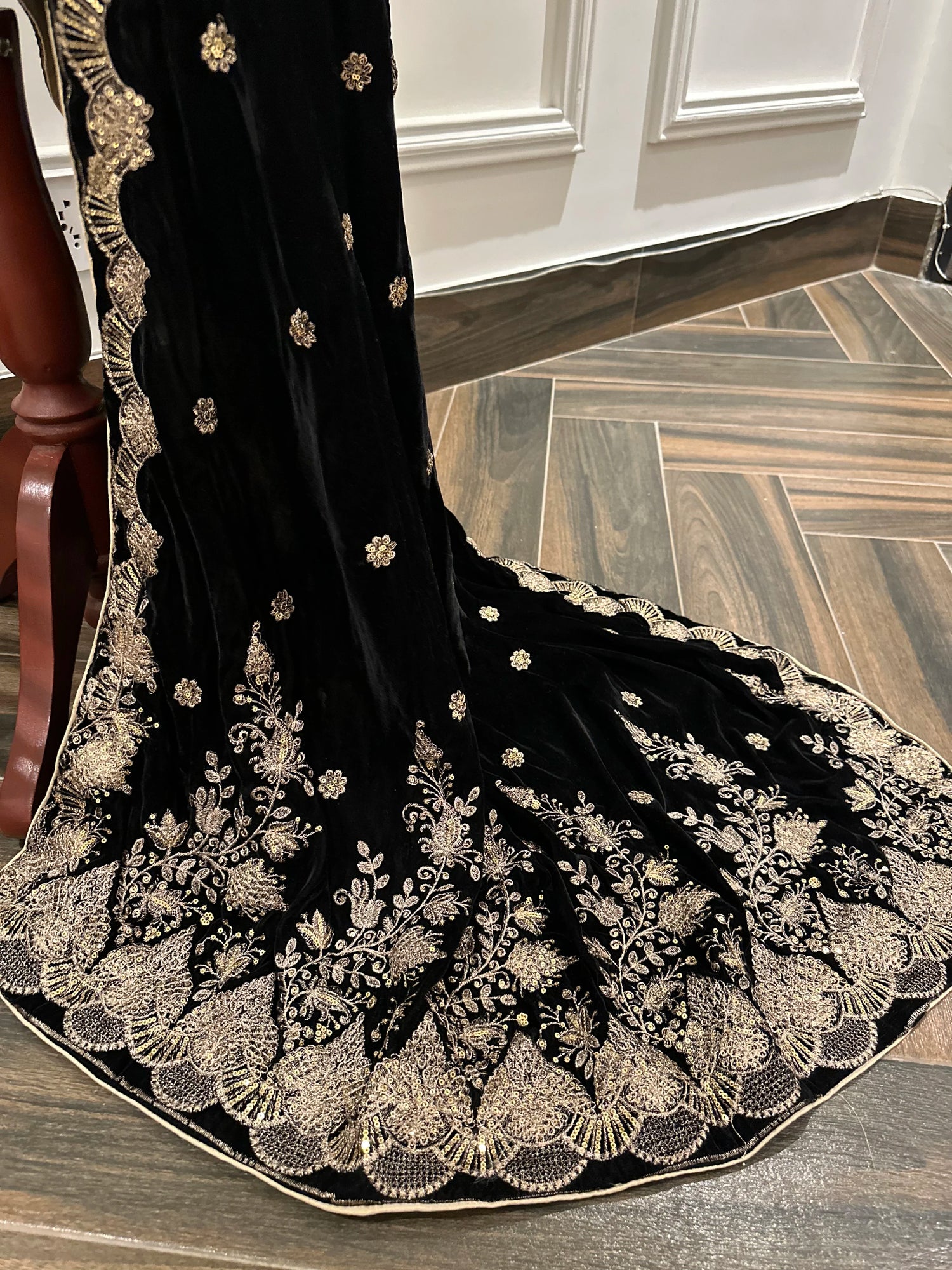 Luxurious velvet shawl featuring detailed embroidery and beautiful crafted motifs, blending traditional artistry with modern elegance for any occasion.