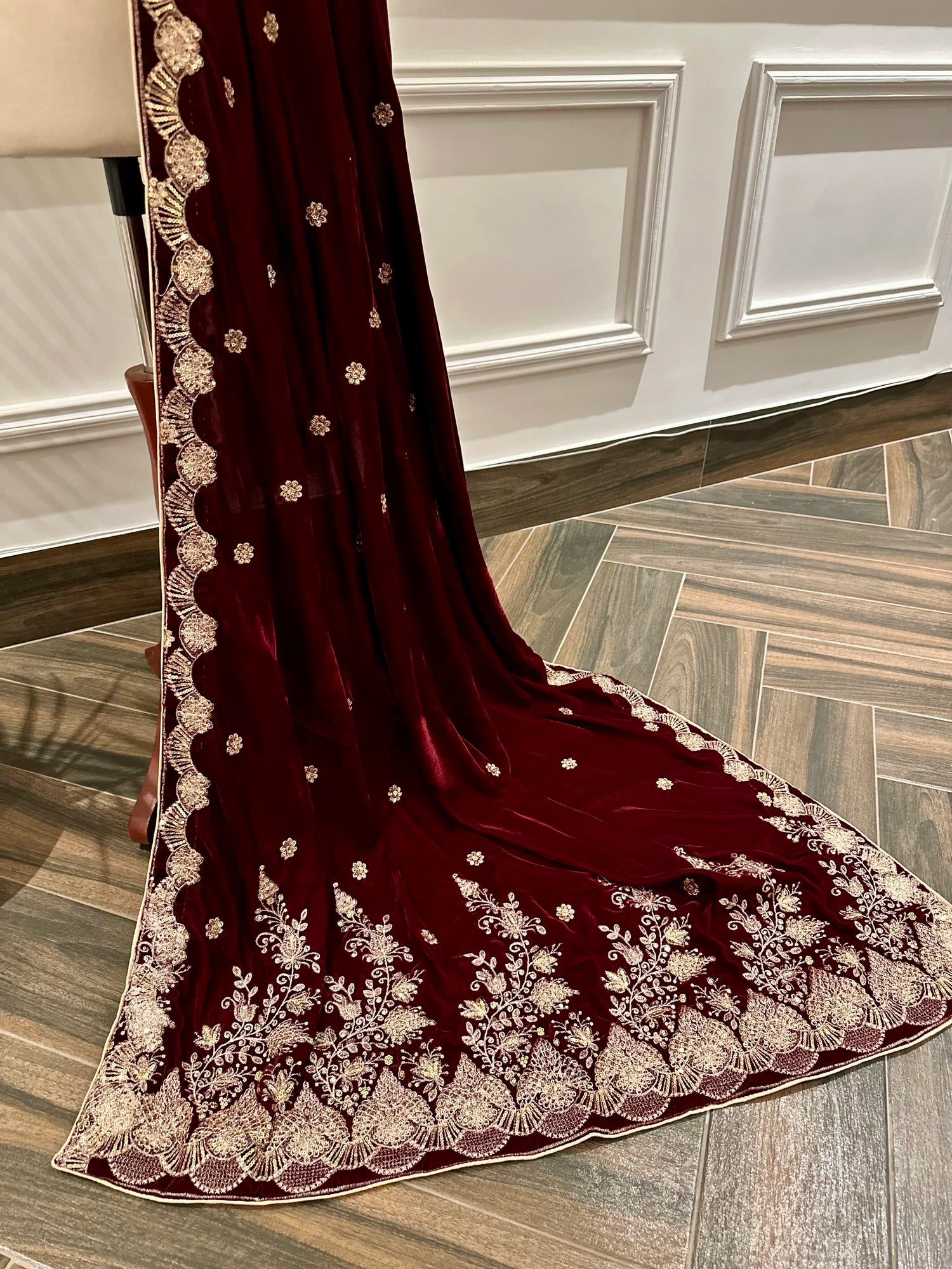 Luxurious velvet shawl featuring detailed embroidery and beautiful crafted motifs, blending traditional artistry with modern elegance for any occasion.