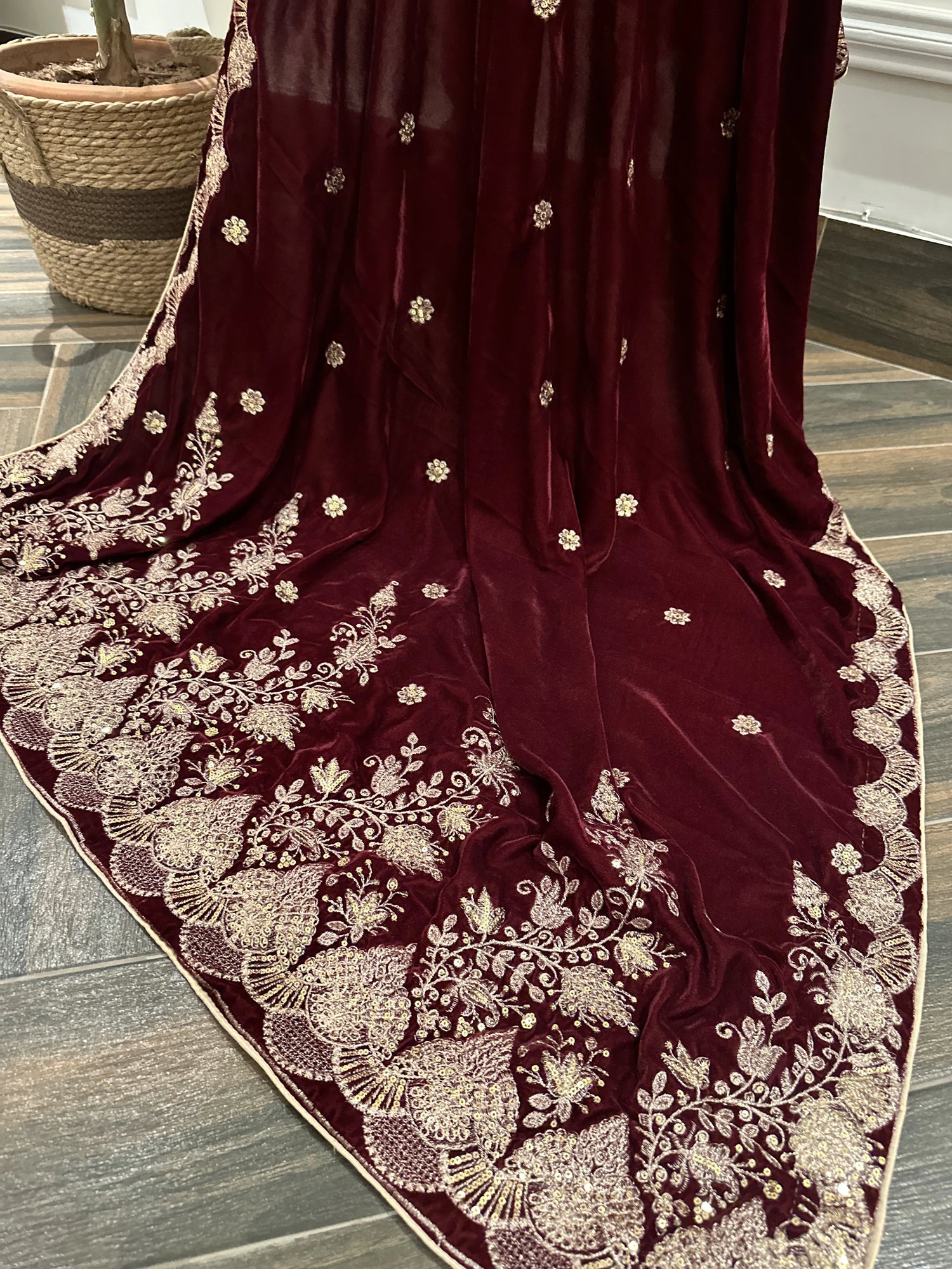 Luxurious velvet shawl featuring detailed embroidery and beautiful crafted motifs, blending traditional artistry with modern elegance for any occasion.