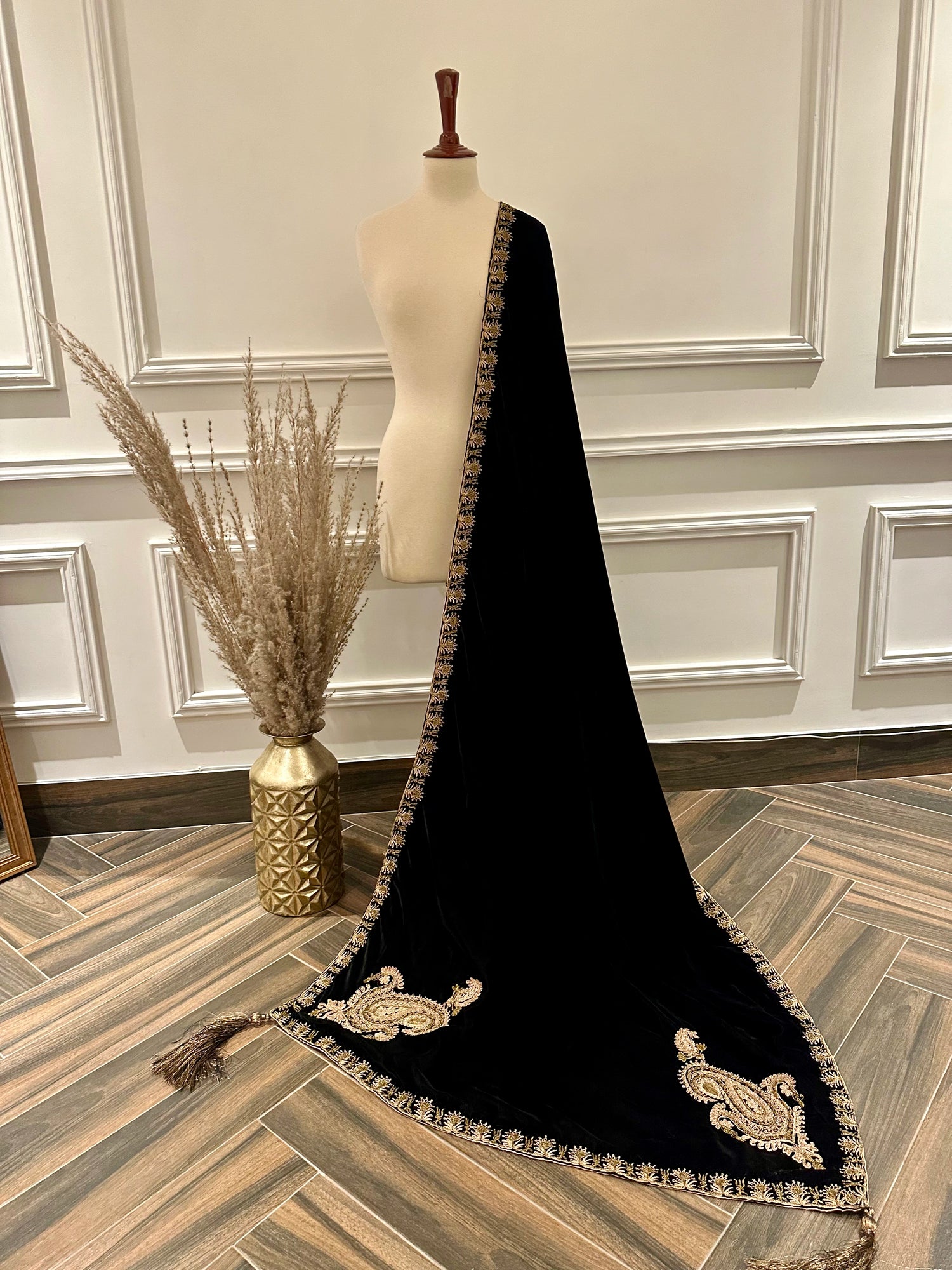 Luxury unisex velvet shawl designed with ari and dori work and embellished motifs on corners adored with jamawar palta edges, and handmade tassels.