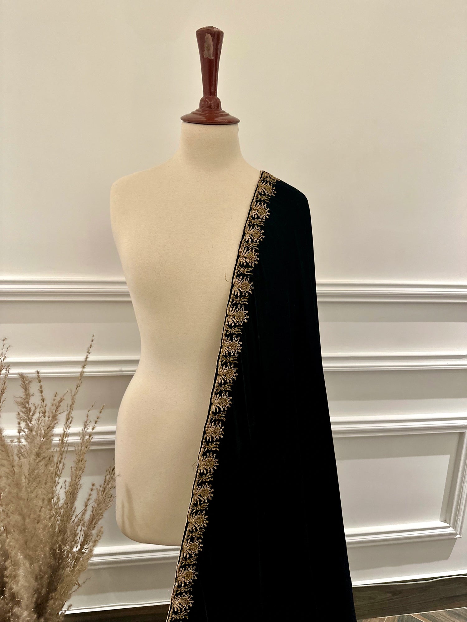 Luxury unisex velvet shawl designed with ari and dori work and embellished motifs on corners adored with jamawar palta edges, and handmade tassels.