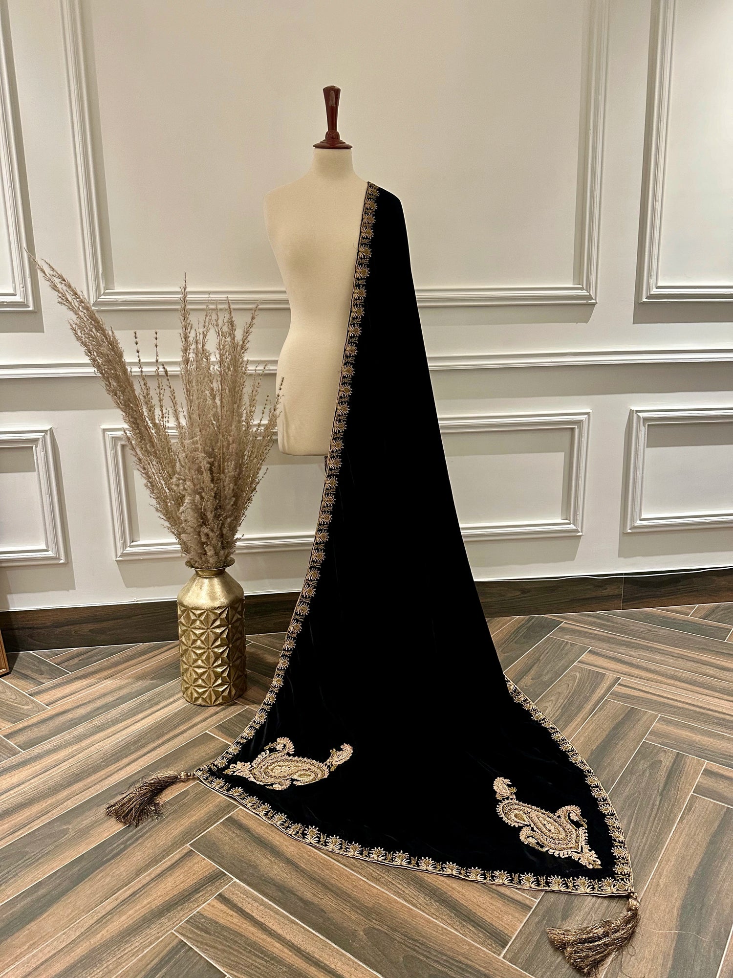 Luxury unisex velvet shawl designed with ari and dori work and embellished motifs on corners adored with jamawar palta edges, and handmade tassels.
