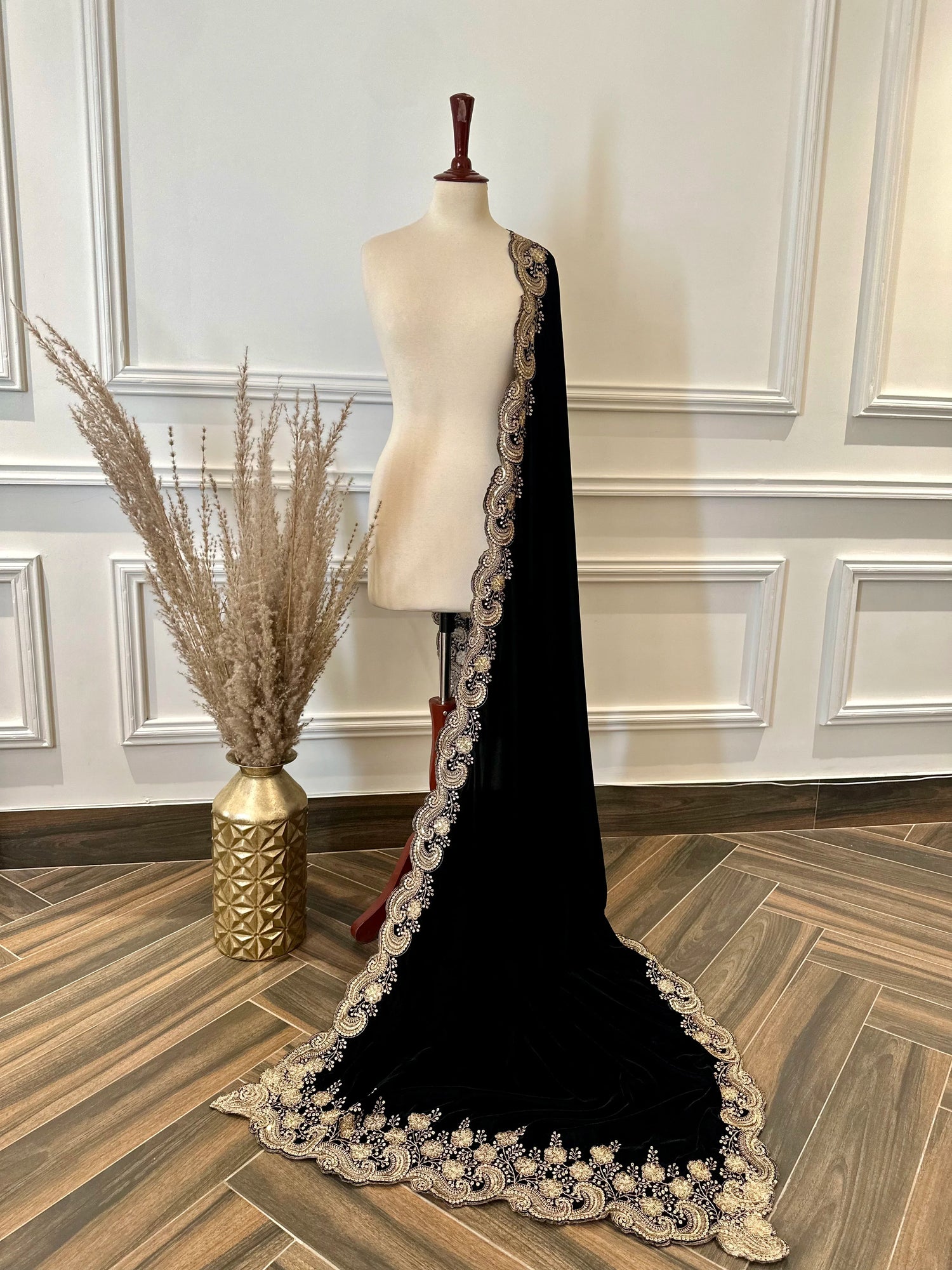 Velvet shawl featuring intricate embellishments and a combination of shimmering tila, sparkling sequins, and delicate stone work. Showcasing exquisite craftsmanship and rich texture, perfect for formal occasions.

