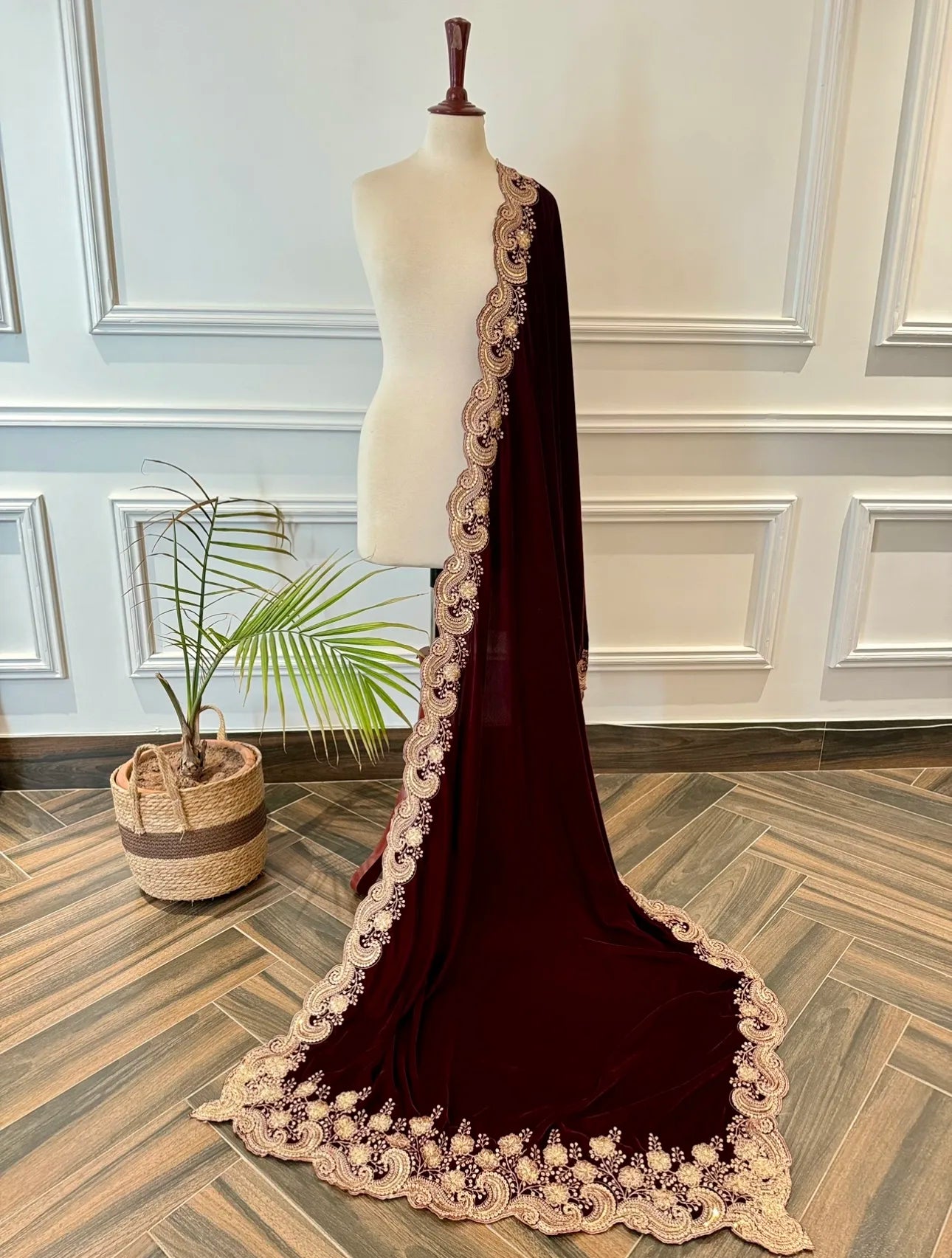 Velvet shawl featuring intricate embellishments and a combination of shimmering tila, sparkling sequins, and delicate stone work. Showcasing exquisite craftsmanship and rich texture, perfect for formal occasions.