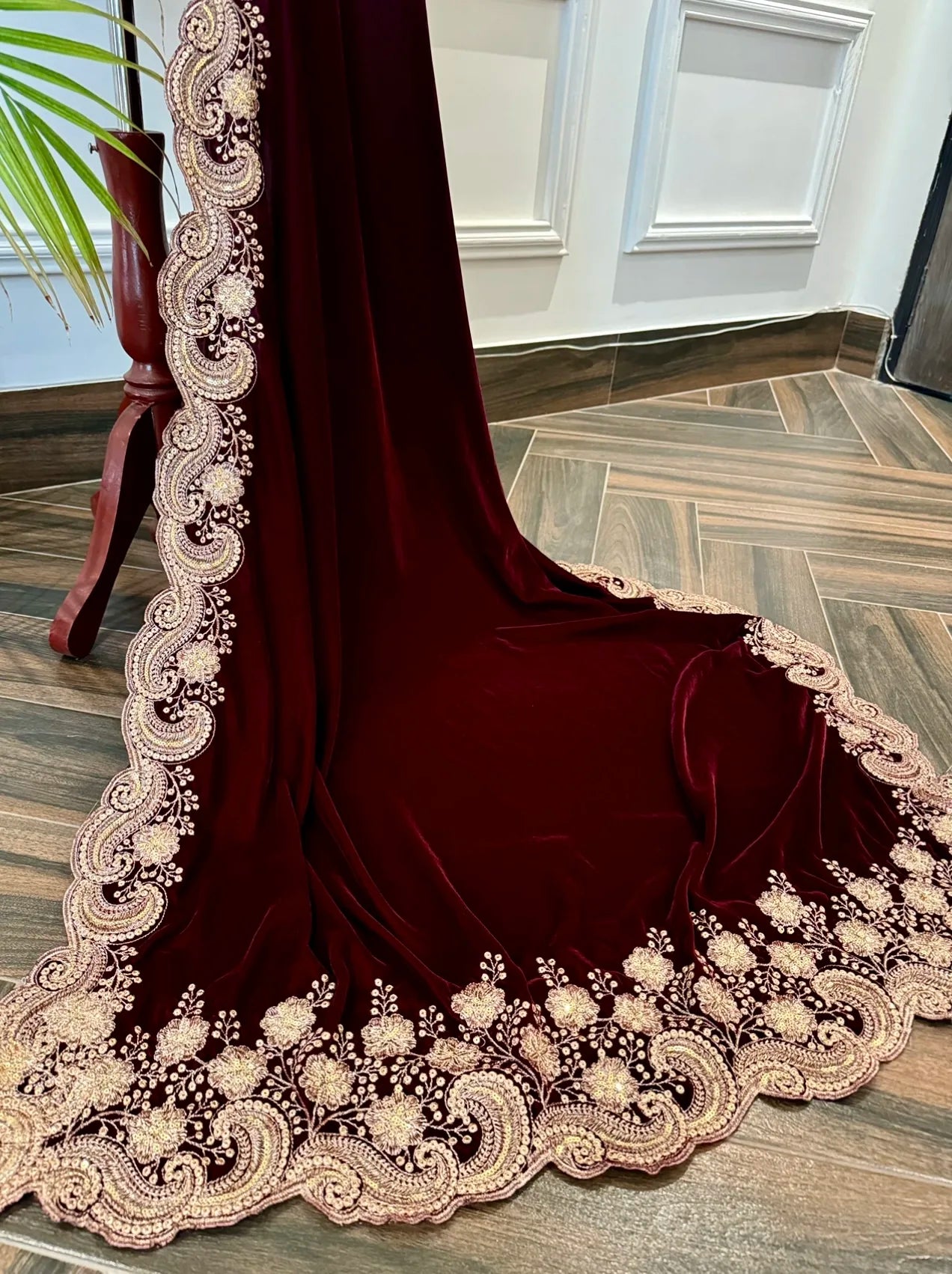 Velvet shawl featuring intricate embellishments and a combination of shimmering tila, sparkling sequins, and delicate stone work. Showcasing exquisite craftsmanship and rich texture, perfect for formal occasions.
