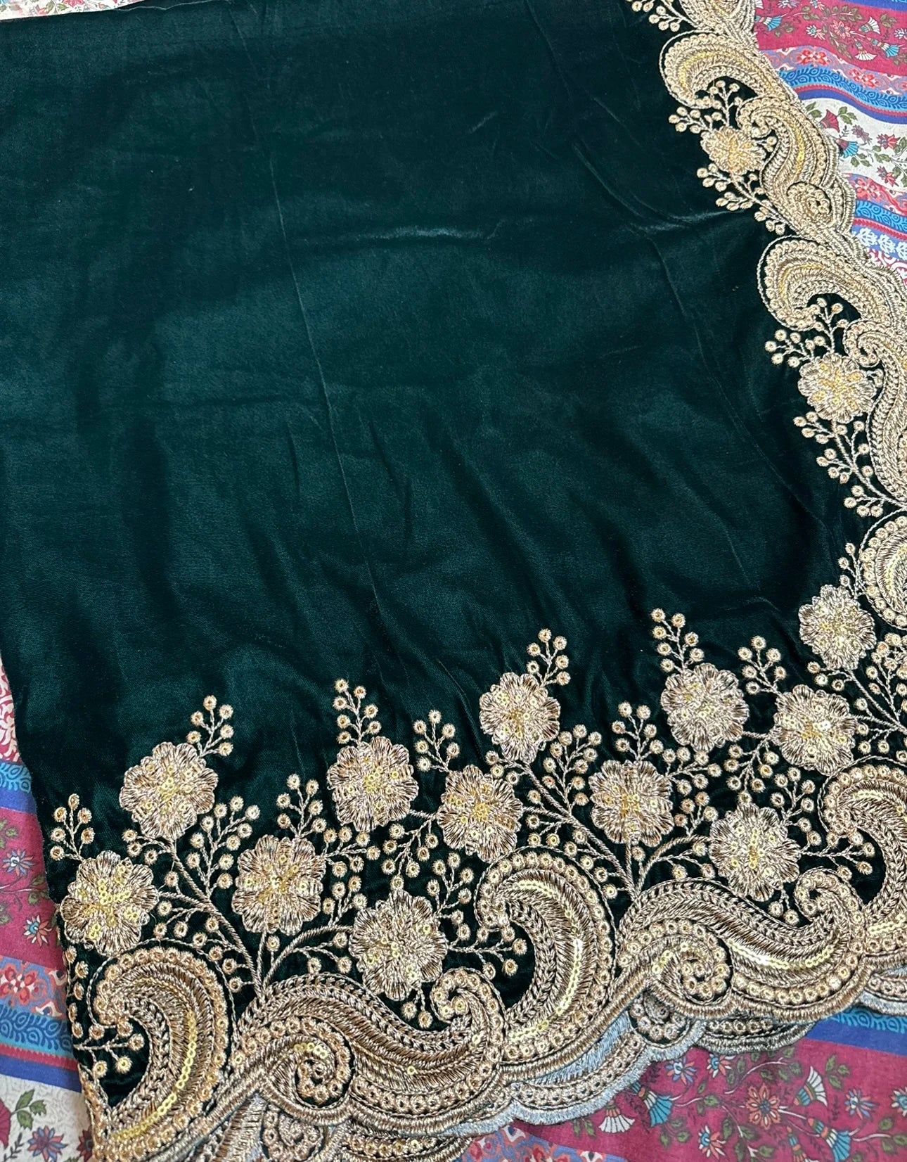 Velvet shawl featuring intricate embellishments and a combination of shimmering tila, sparkling sequins, and delicate stone work. Showcasing exquisite craftsmanship and rich texture, perfect for formal occasions.