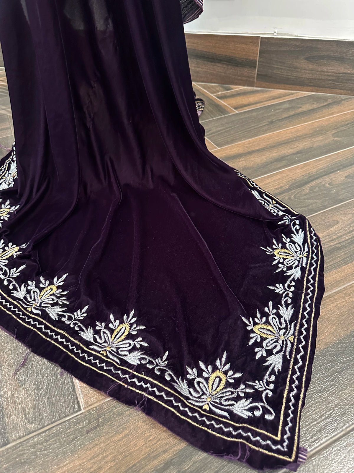 Elevate your style with velvet shawl, handcrafted silver and gold floral embroidery along the border, featuring a rich texture and elegant drape, perfect for weddings and festive occasions.