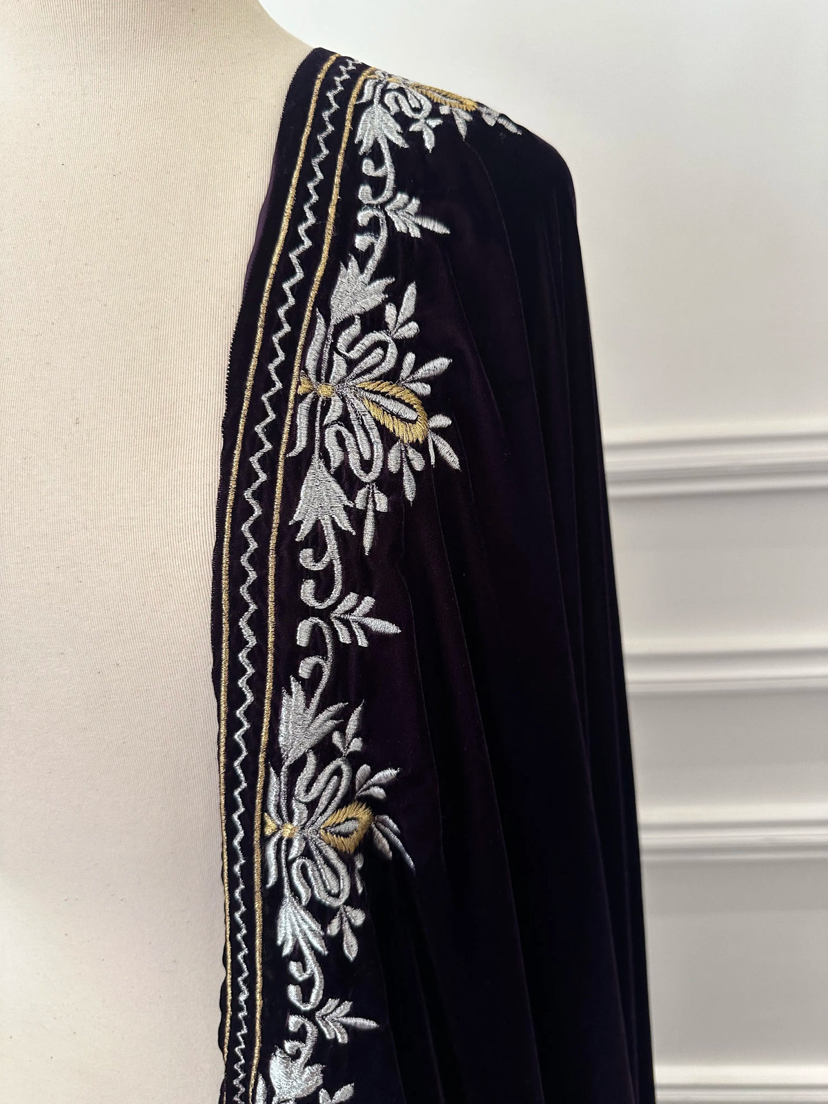 Elevate your style with velvet shawl, handcrafted silver and gold floral embroidery along the border, featuring a rich texture and elegant drape, perfect for weddings and festive occasions.
