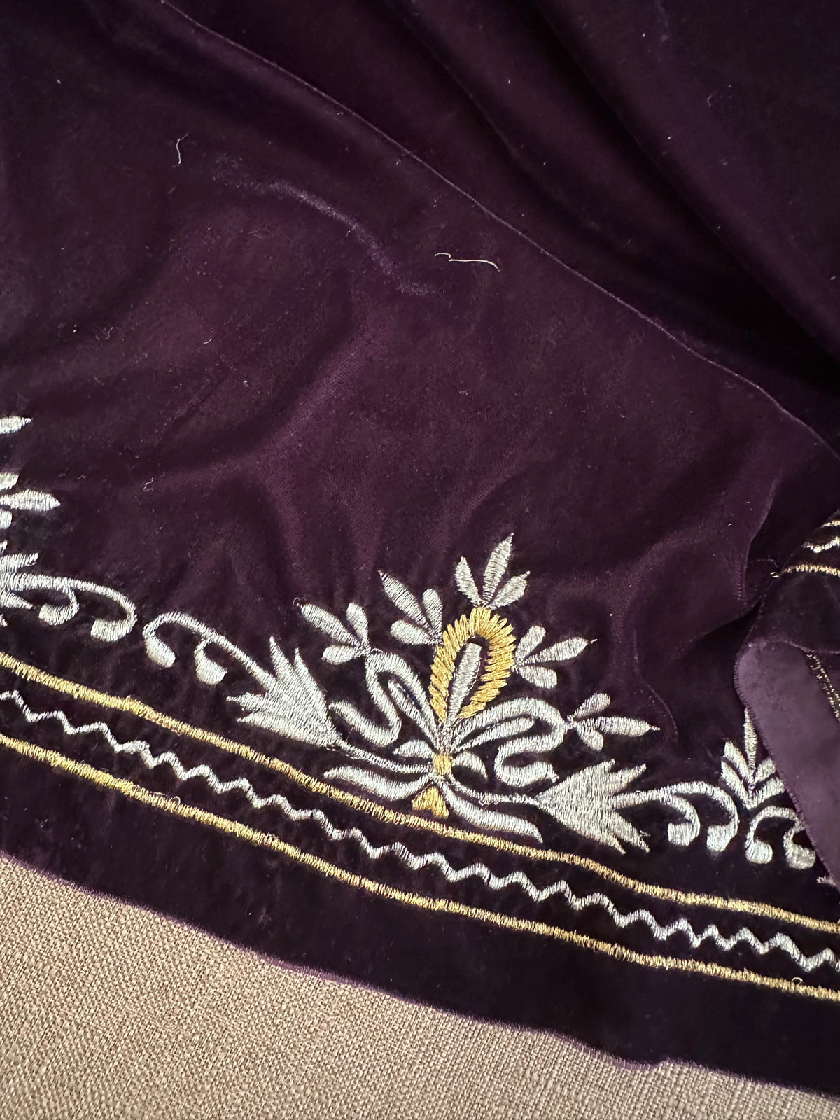 Elevate your style with velvet shawl, handcrafted silver and gold floral embroidery along the border, featuring a rich texture and elegant drape, perfect for weddings and festive occasions.