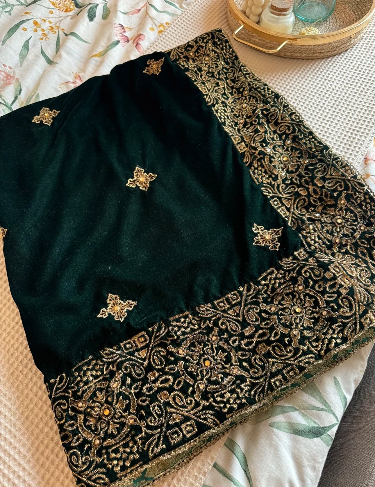 Luxurious velvet shawl adorned with gold tila embroidery, stone work and tassels, ideal for enhancing festive and formal attire.