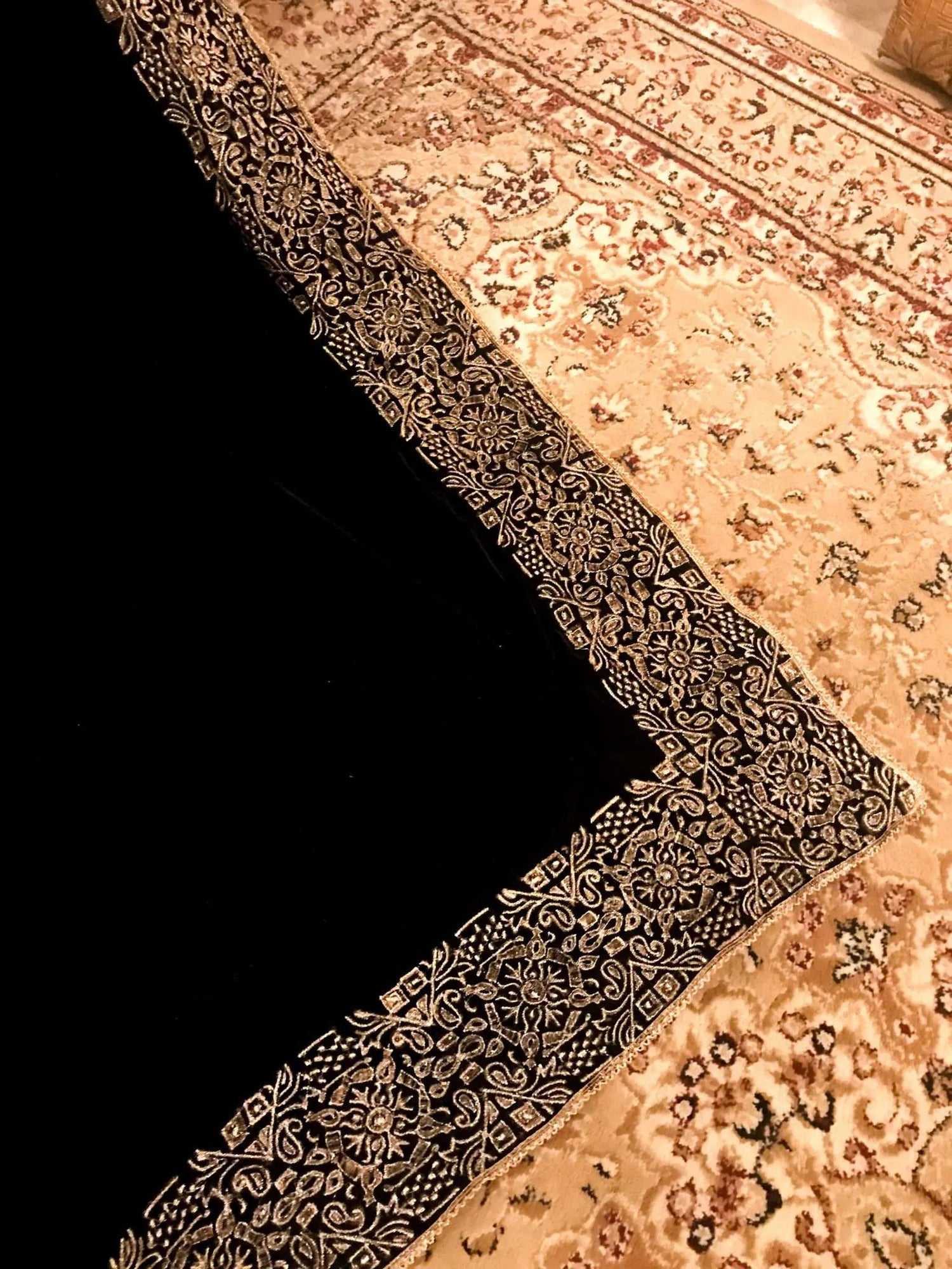 Elegant velvet shawl with a golden border, adorned with geometric block printed motifs and tila embroidery, perfect for formal occasions.