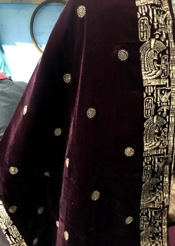 Elegant velvet shawl featuring intricate motifs with block printed border showcasing luxurious finish, ideal for stylish gatherings and formal events.