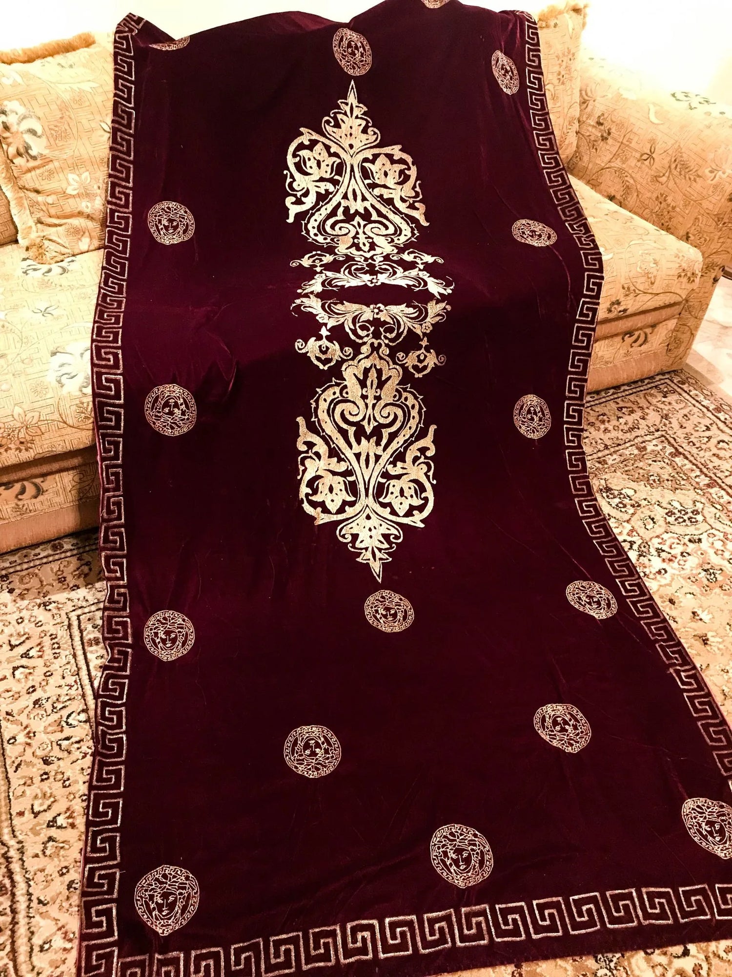 Luxurious velvet shawl adorned with gold block printed motif, showcasing elegant geometric patterns and Versace-inspired designs.