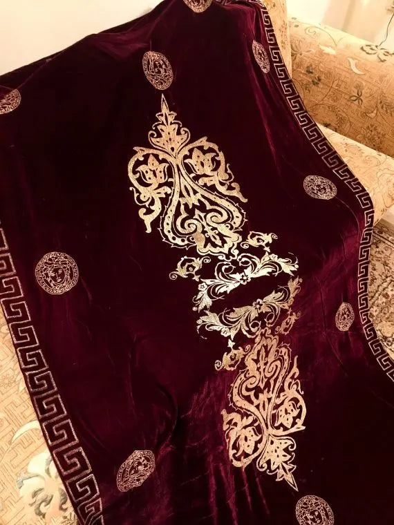 Luxurious velvet shawl adorned with gold block printed motif, showcasing elegant geometric patterns and Versace-inspired designs.