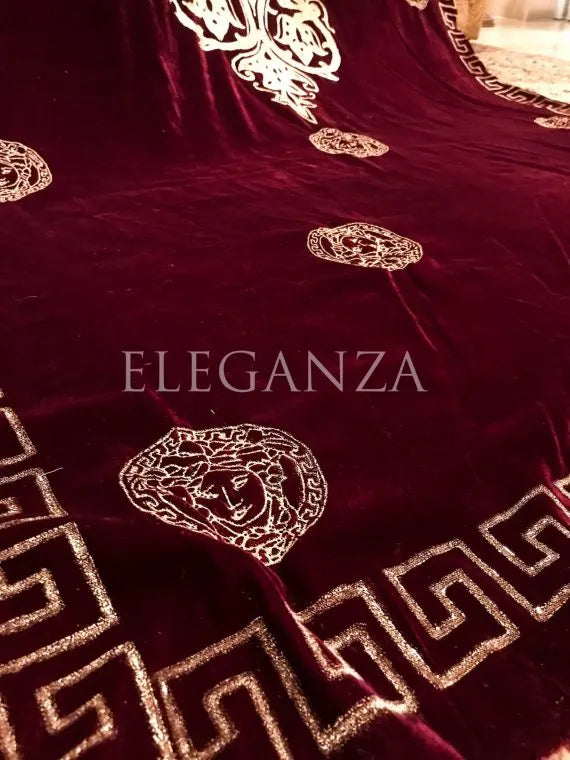 Luxurious velvet shawl adorned with gold block printed motif, showcasing elegant geometric patterns and Versace-inspired designs.