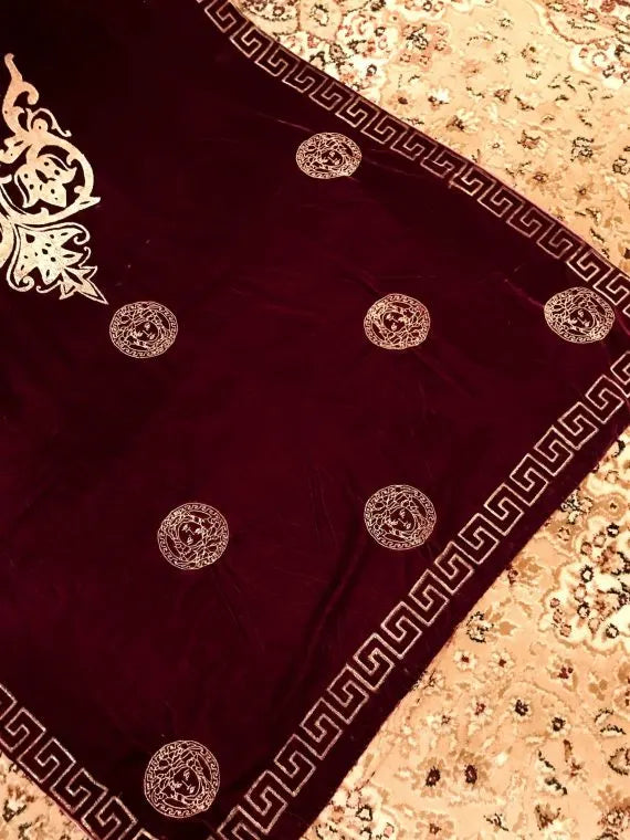 Luxurious velvet shawl adorned with gold block printed motif, showcasing elegant geometric patterns and Versace-inspired designs.