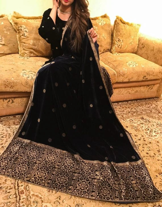 Elegant velvet shawl showcasing  luxurious double geometric block printed border, exuding sophistication and traditional charm.