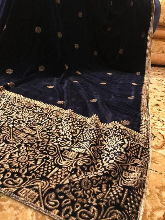 Elegant velvet shawl showcasing  luxurious double geometric block printed border, exuding sophistication and traditional charm.