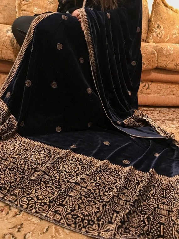 Elegant velvet shawl showcasing  luxurious double geometric block printed border, exuding sophistication and traditional charm.