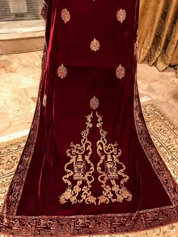 Luxurious velvet shawl with gold embroidery, featuring Mughal-inspired prints and a floral chata pattern, perfect for versatile styling and festive occasion.
