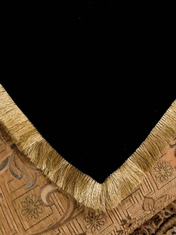 Luxurious black velvet shawl featuring gold kiran lacing, designed to enhance style and comfort during festive occasions.