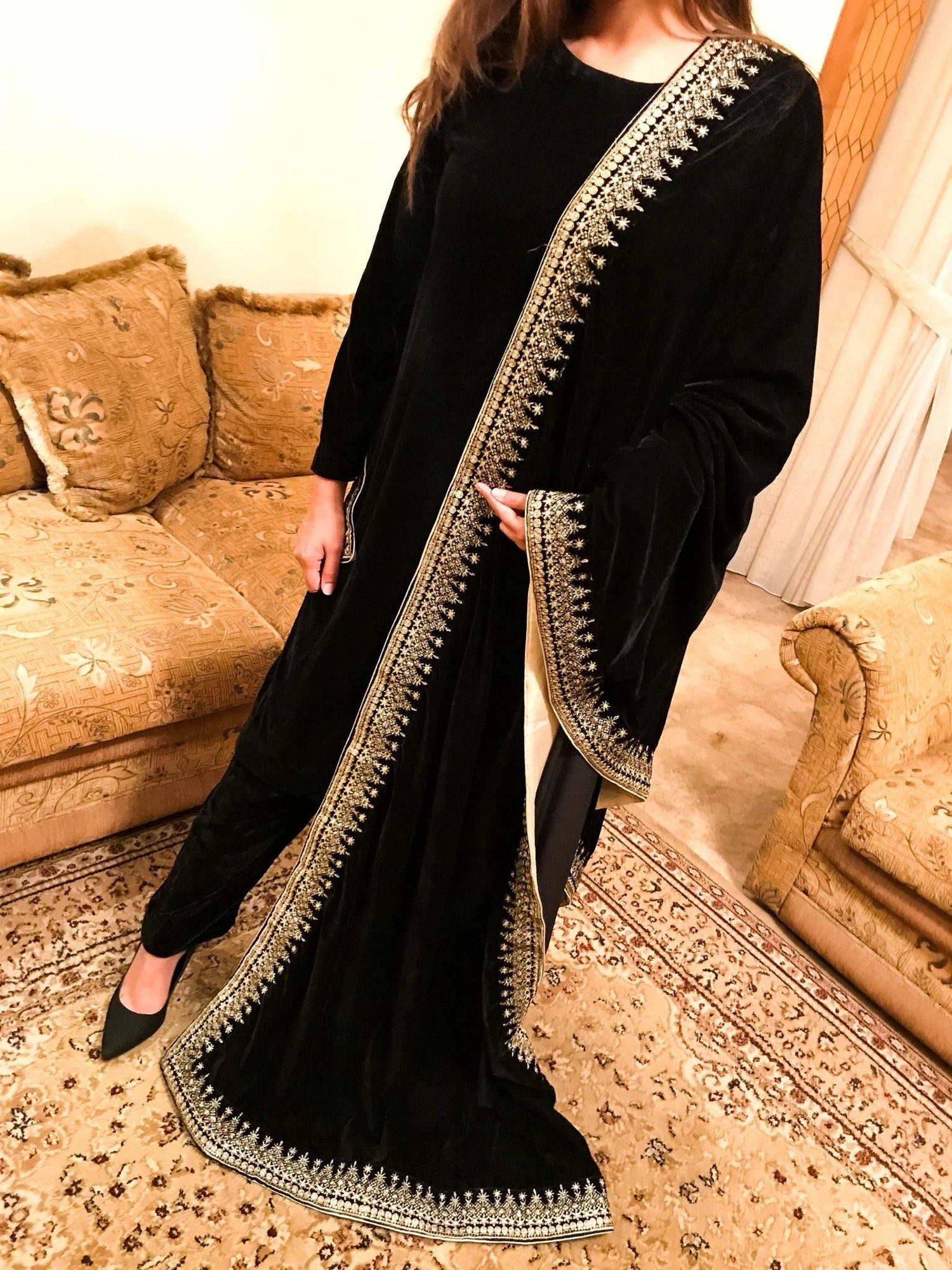 A sophisticated velvet shawl adorned with a luxurious intricate tila embroidery. Perfect for festive occasions and formal events.
