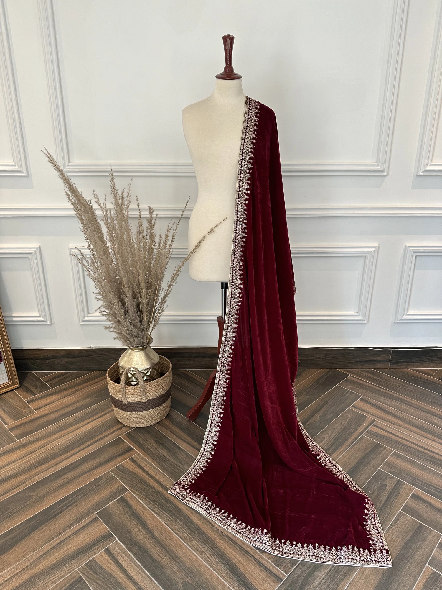 A sophisticated velvet shawl adorned with a luxurious intricate tila embroidery. Perfect for festive occasions and formal events.