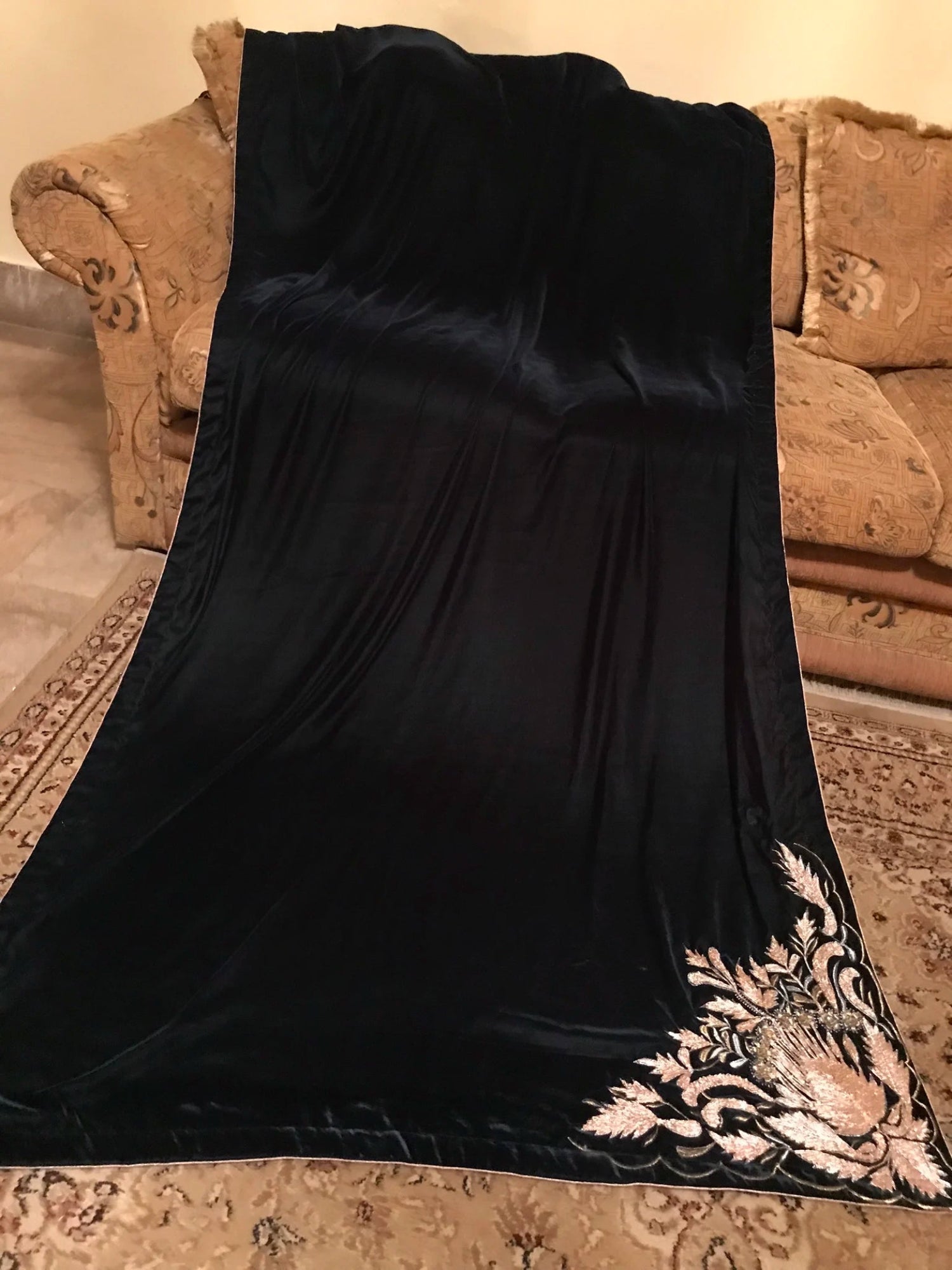Elegant velvet shawl adored with intricate gota embroidery, featuring floral motifs and a satin silk edged border for glamorous look.