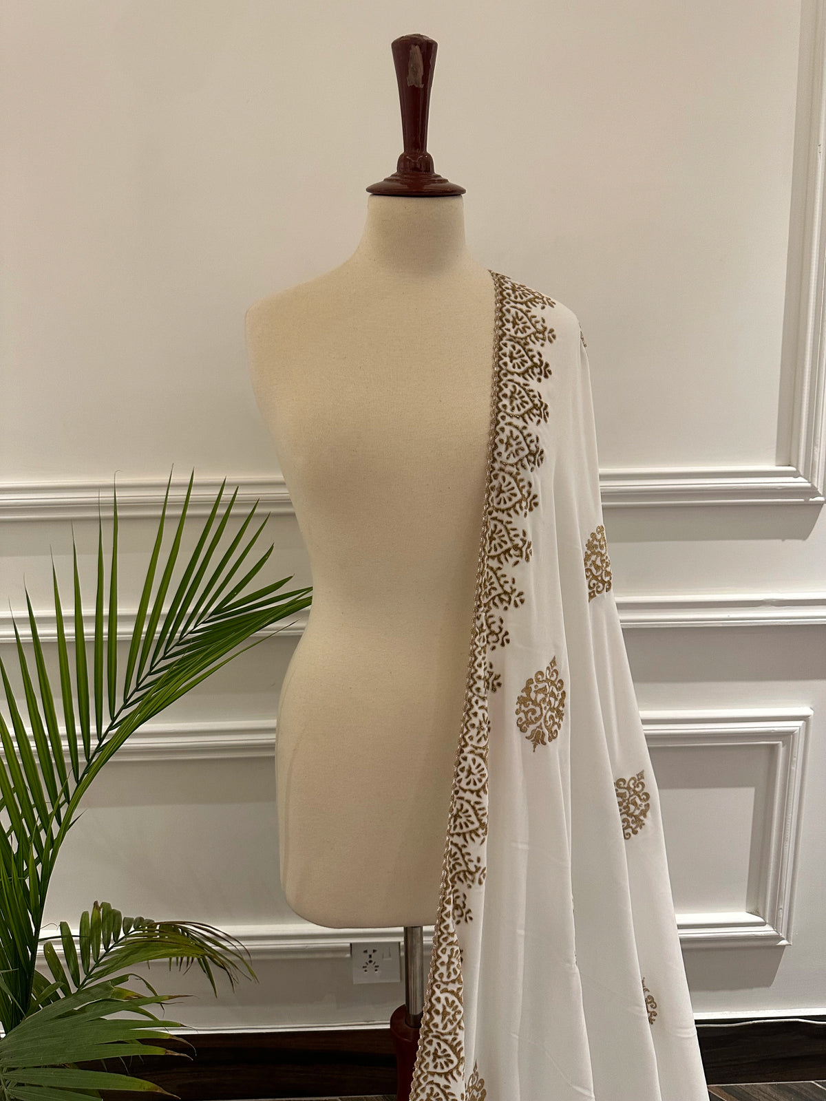 White and Gold Embroidery, a masterpiece of traditional craftsmanship, featuring a pristine white fabric adorned with intricate gold tilla embroidery and delicate florals motif.