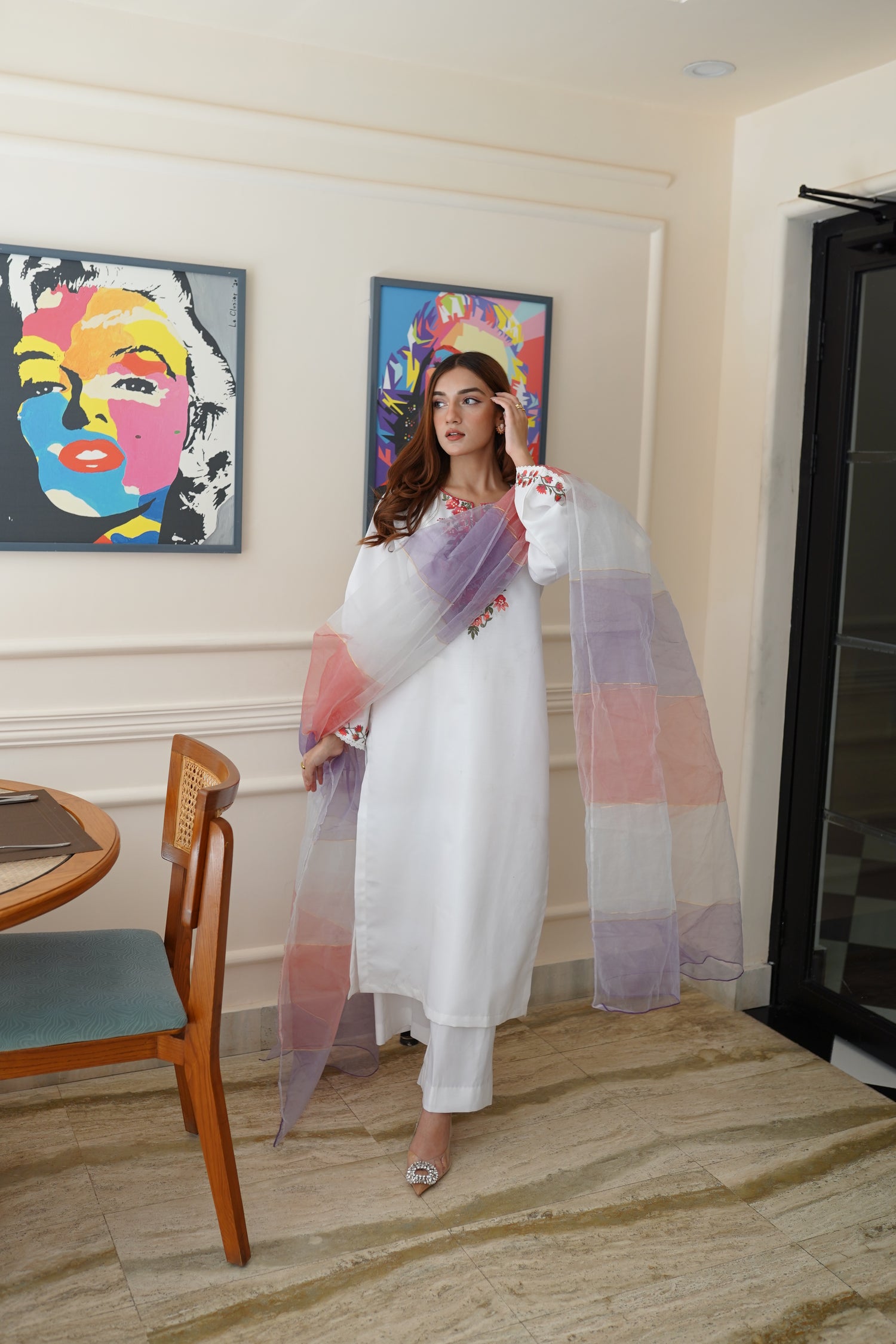 White dress paired with pink and lilac color showcasing refined style and grace.