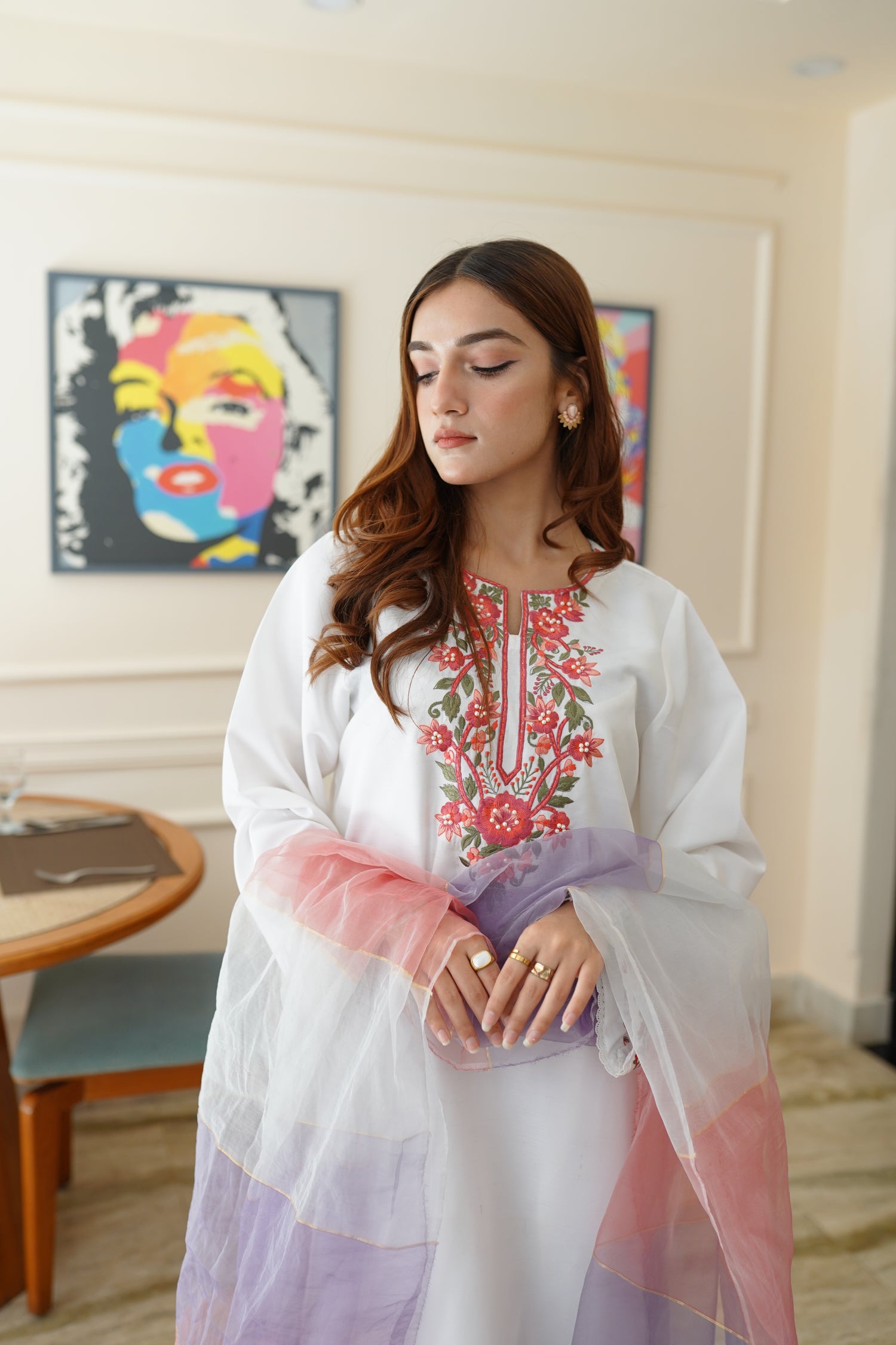 White dress paired with pink and lilac color showcasing refined style and grace.