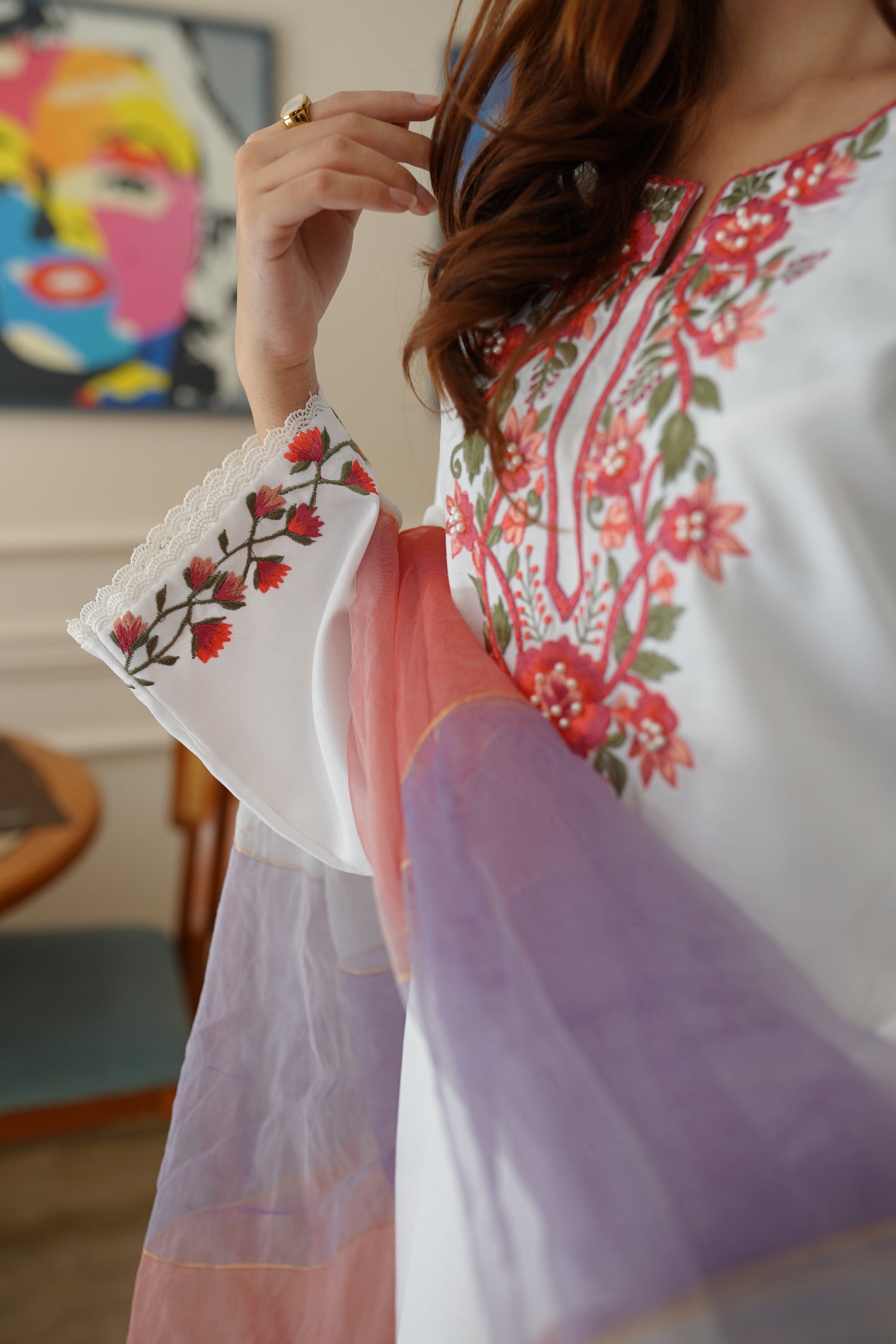 White dress paired with pink and lilac color showcasing refined style and grace.