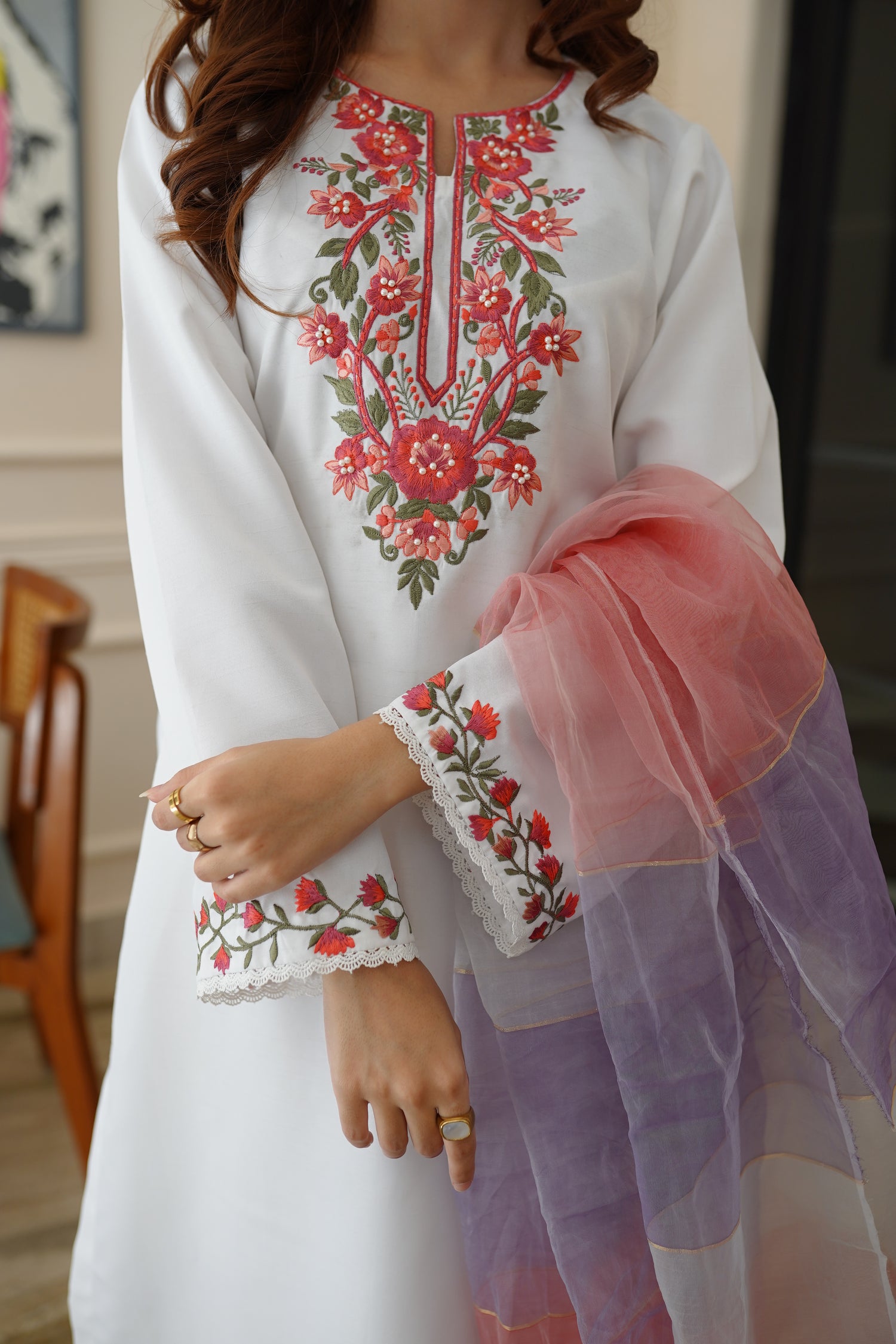 White dress paired with pink and lilac color showcasing refined style and grace.