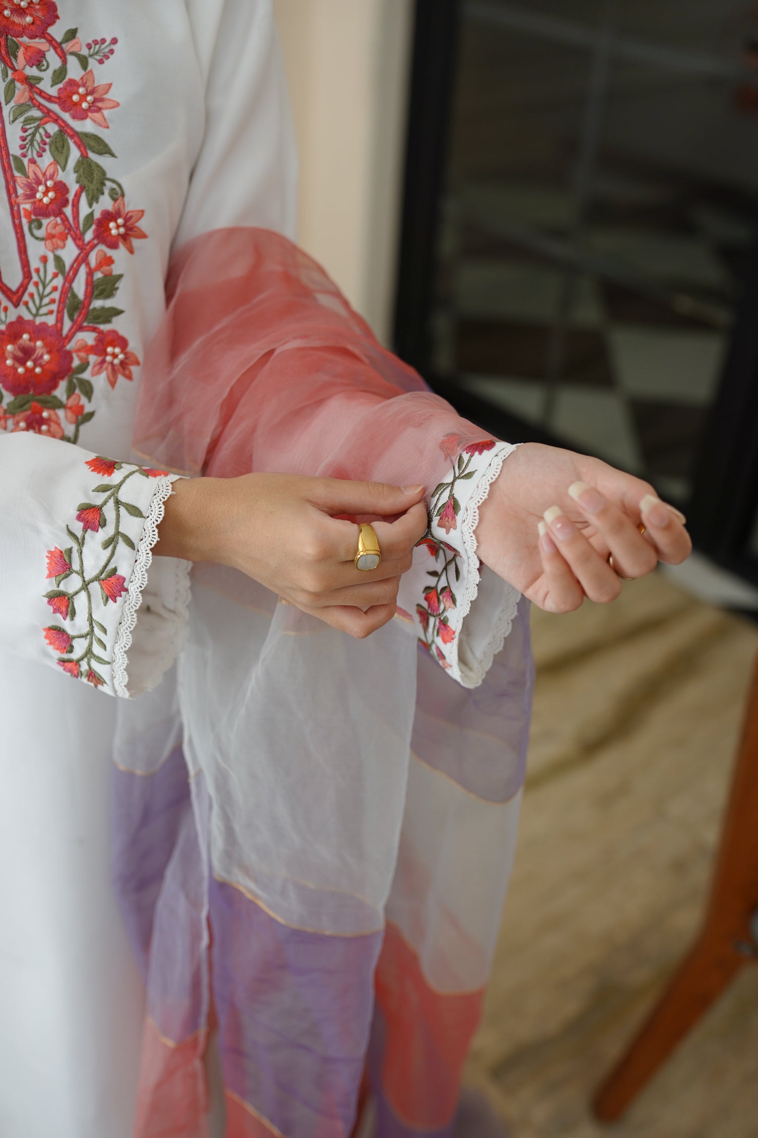 White dress paired with pink and lilac color showcasing refined style and grace.