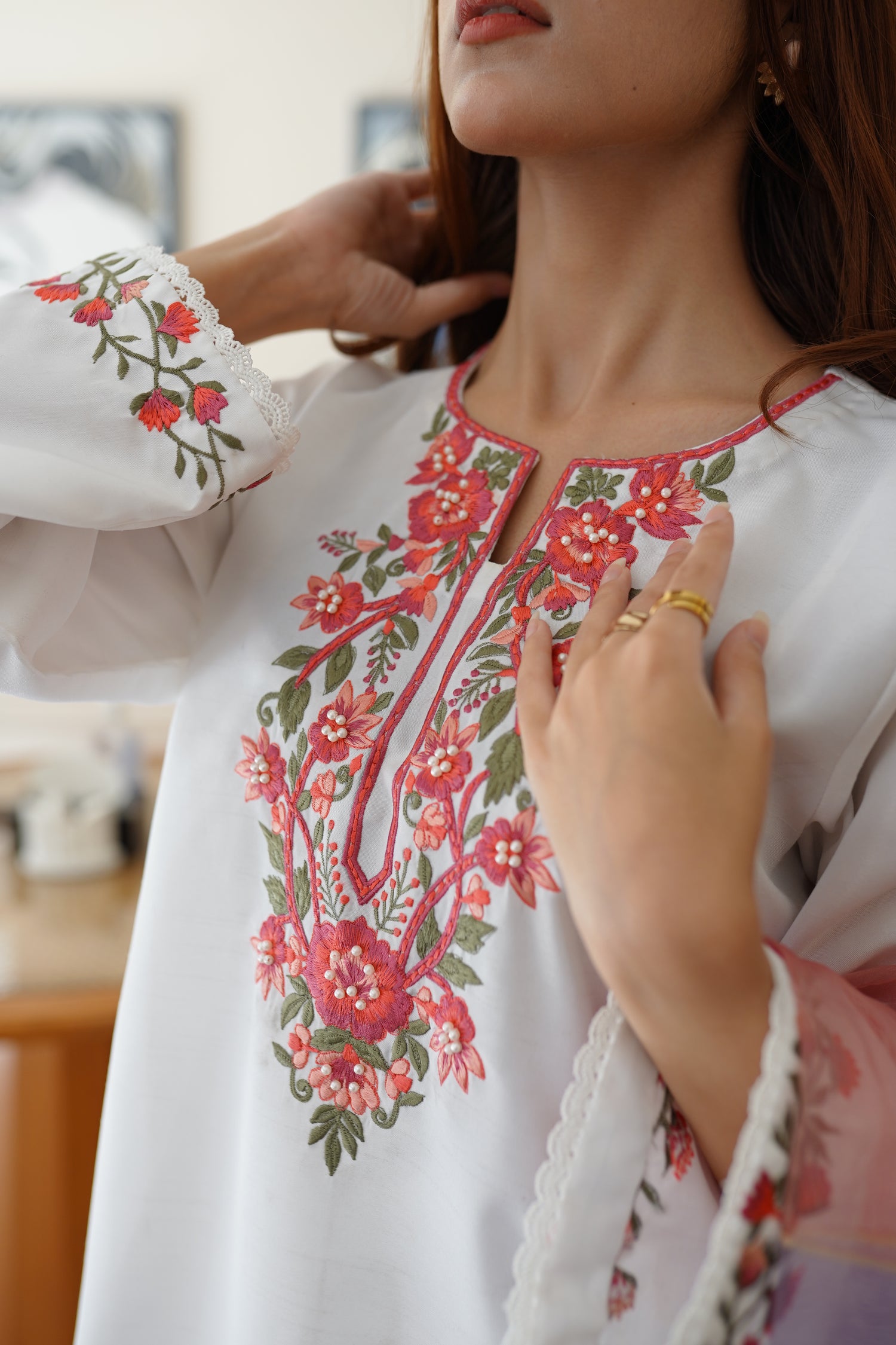 White dress paired with pink and lilac color showcasing refined style and grace.