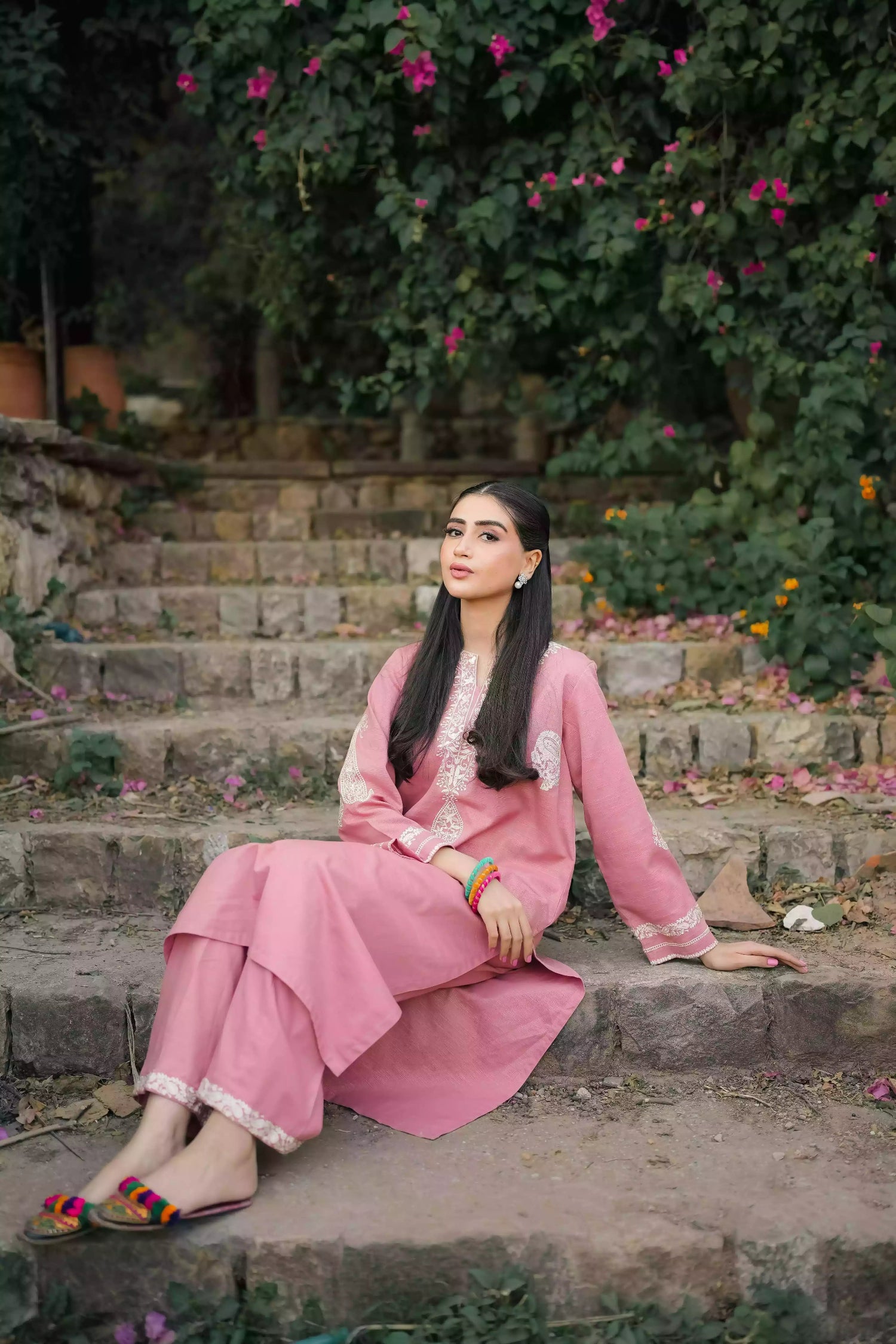 Soft pink kurta featuring intricate white embroidery on the neckline and sleeves. Made from breathable fabric with a relaxed silhouette, the outfit blends traditional elegance with comfortable, refined style suitable for everyday wear or festive occasions.