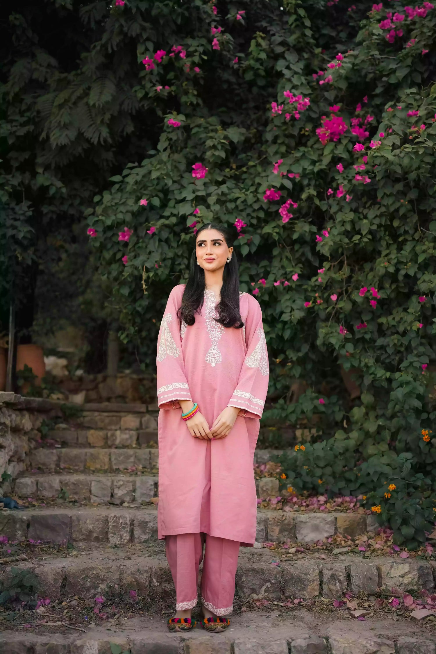 Soft pink kurta featuring intricate white embroidery on the neckline and sleeves. Made from breathable fabric with a relaxed silhouette, the outfit blends traditional elegance with comfortable, refined style suitable for everyday wear or festive occasions.