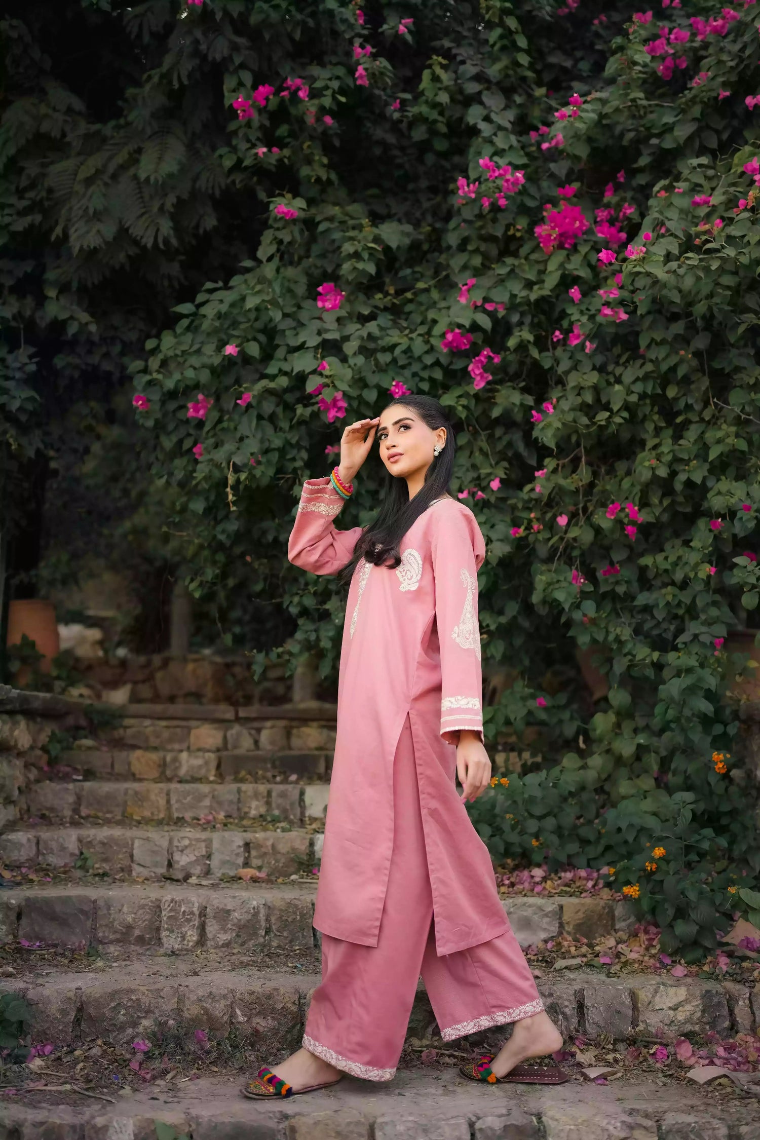 Soft pink kurta featuring intricate white embroidery on the neckline and sleeves. Made from breathable fabric with a relaxed silhouette, the outfit blends traditional elegance with comfortable, refined style suitable for everyday wear or festive occasions.