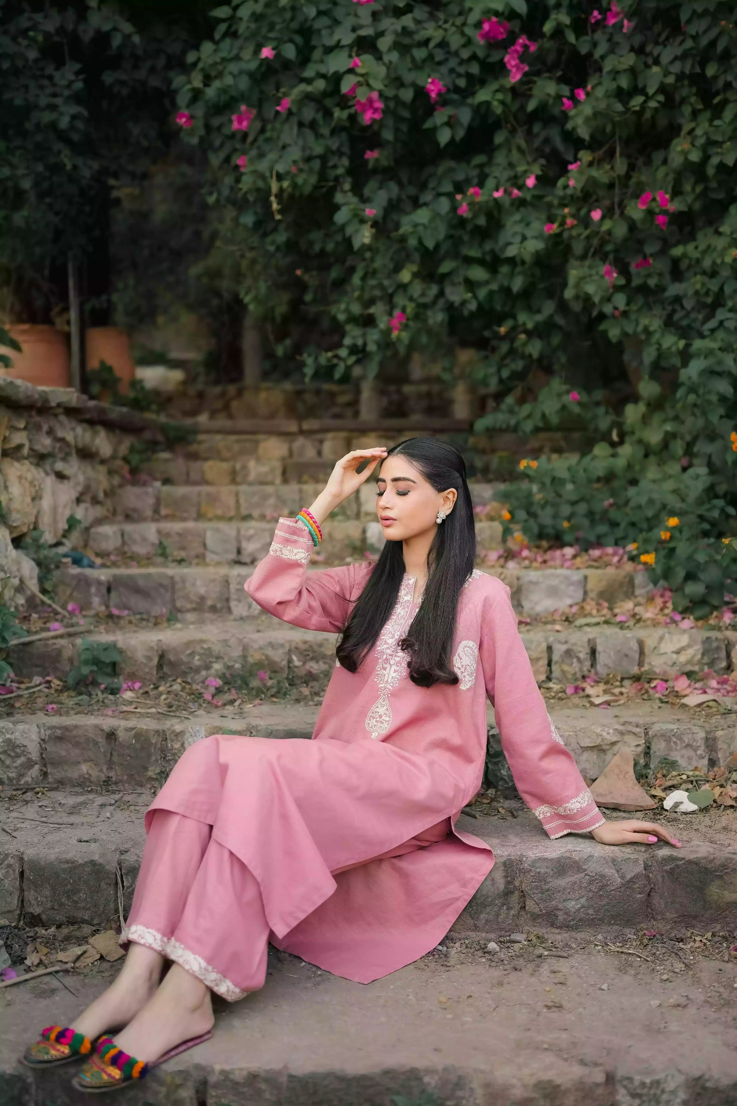 Soft pink kurta featuring intricate white embroidery on the neckline and sleeves. Made from breathable fabric with a relaxed silhouette, the outfit blends traditional elegance with comfortable, refined style suitable for everyday wear or festive occasions.