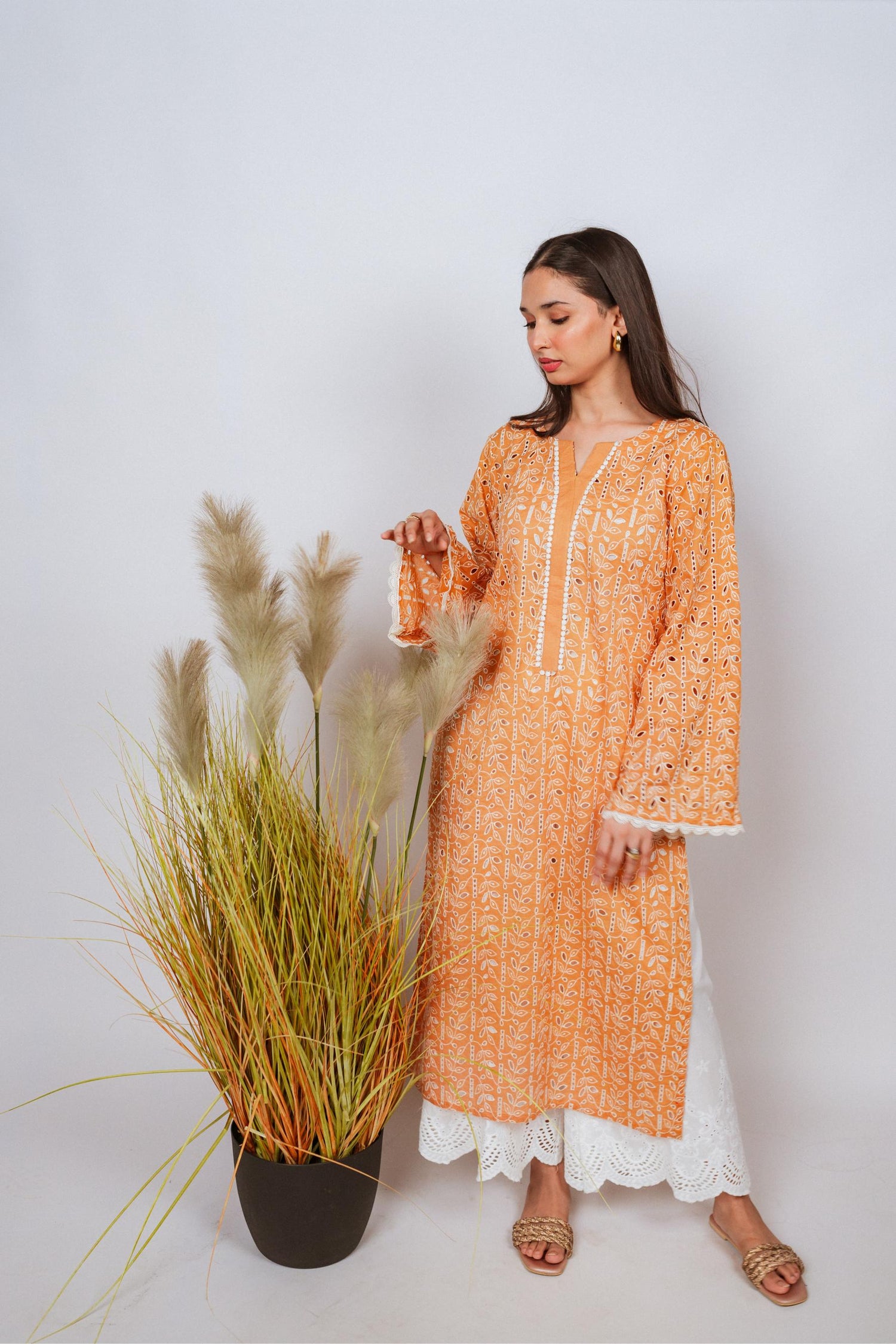 Mustard Chikan kurta with off-white floral embroidery and lace neckline