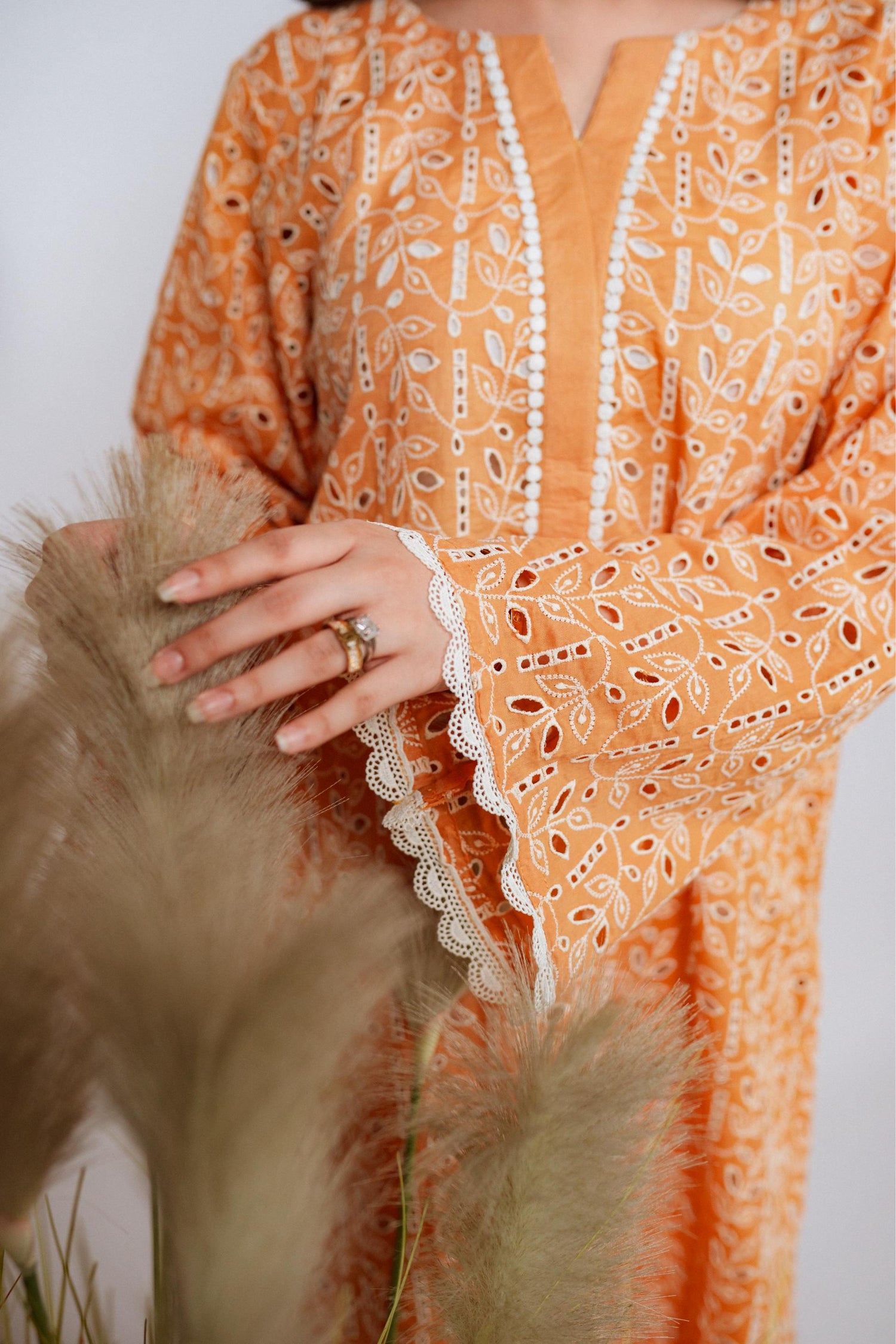 Mustard Chikan kurta with off-white floral embroidery and lace neckline