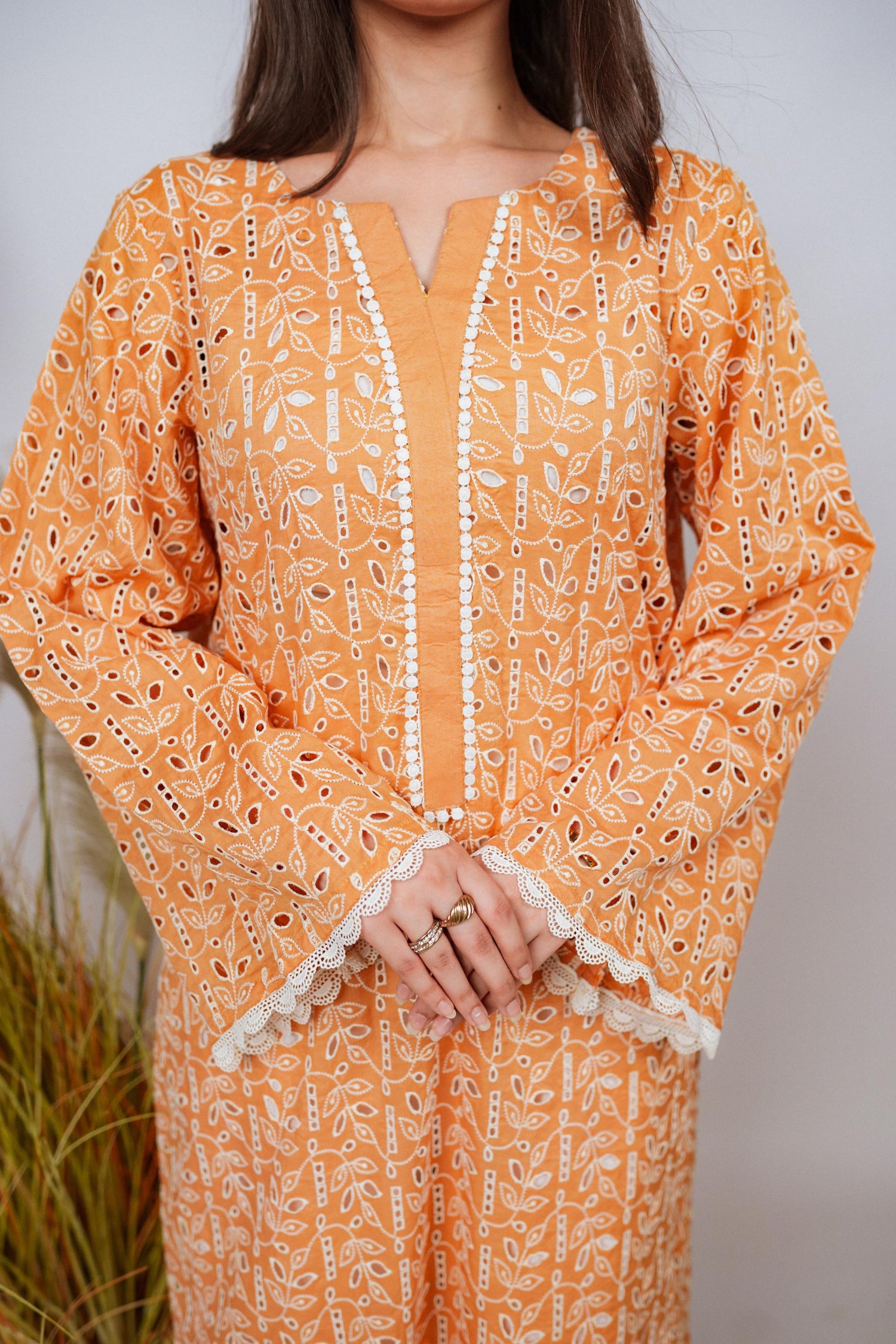 Mustard Chikan kurta with off-white floral embroidery and lace neckline